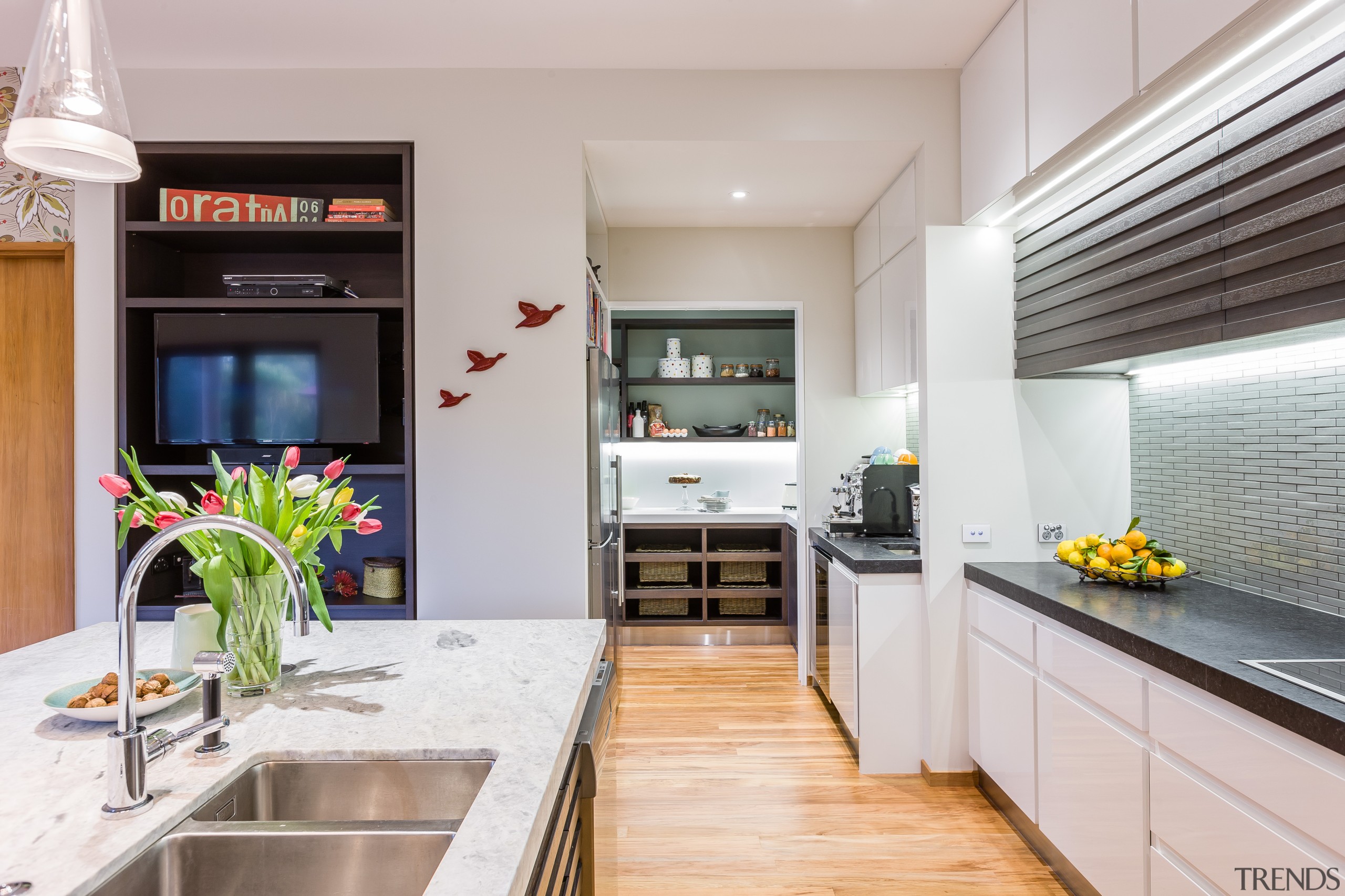 This walk-in pantry continues the two-tone theme of countertop, interior design, kitchen, real estate, gray