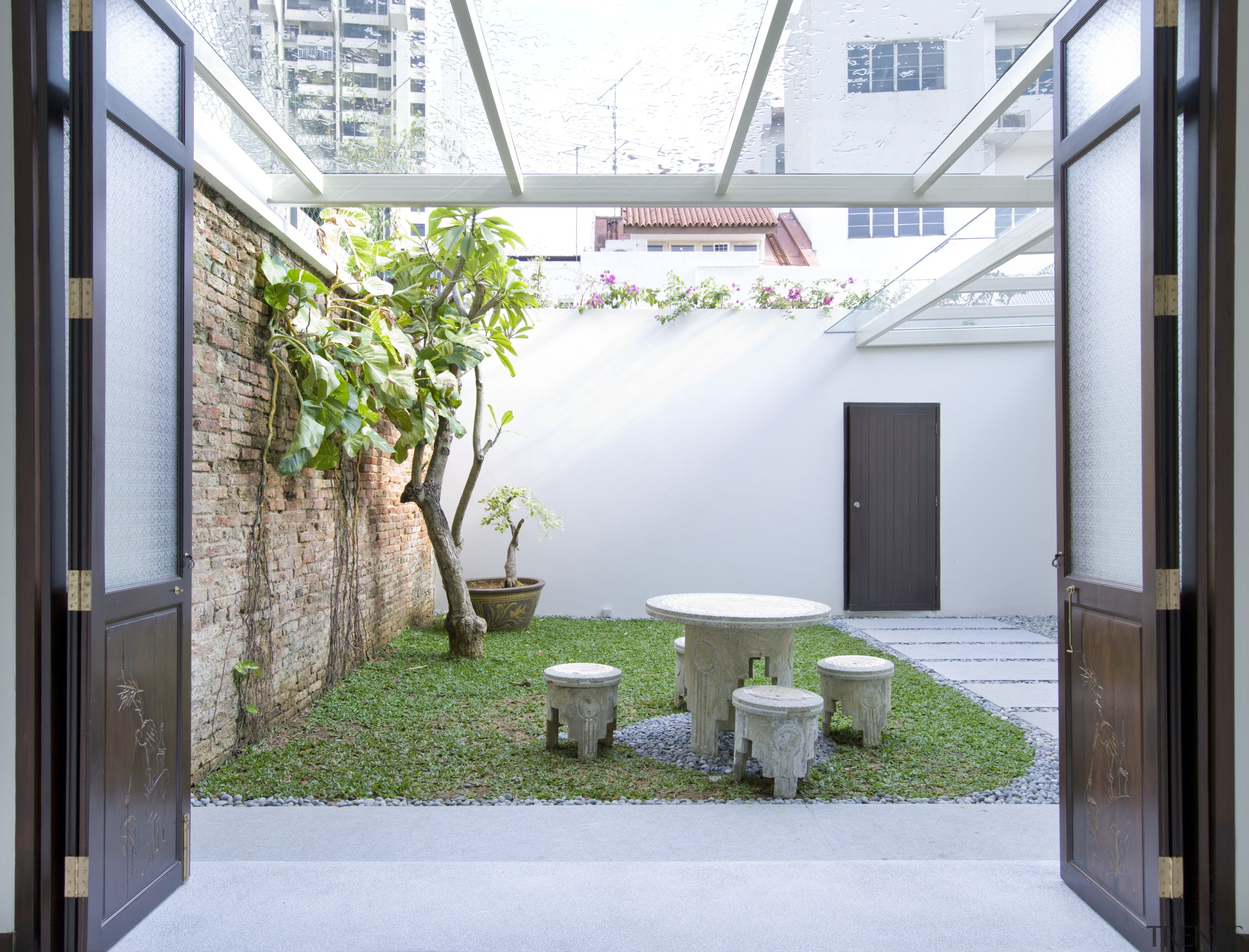 Outdoor seating area with double doors from house architecture, courtyard, daylighting, house, interior design, property, real estate, roof, window, white