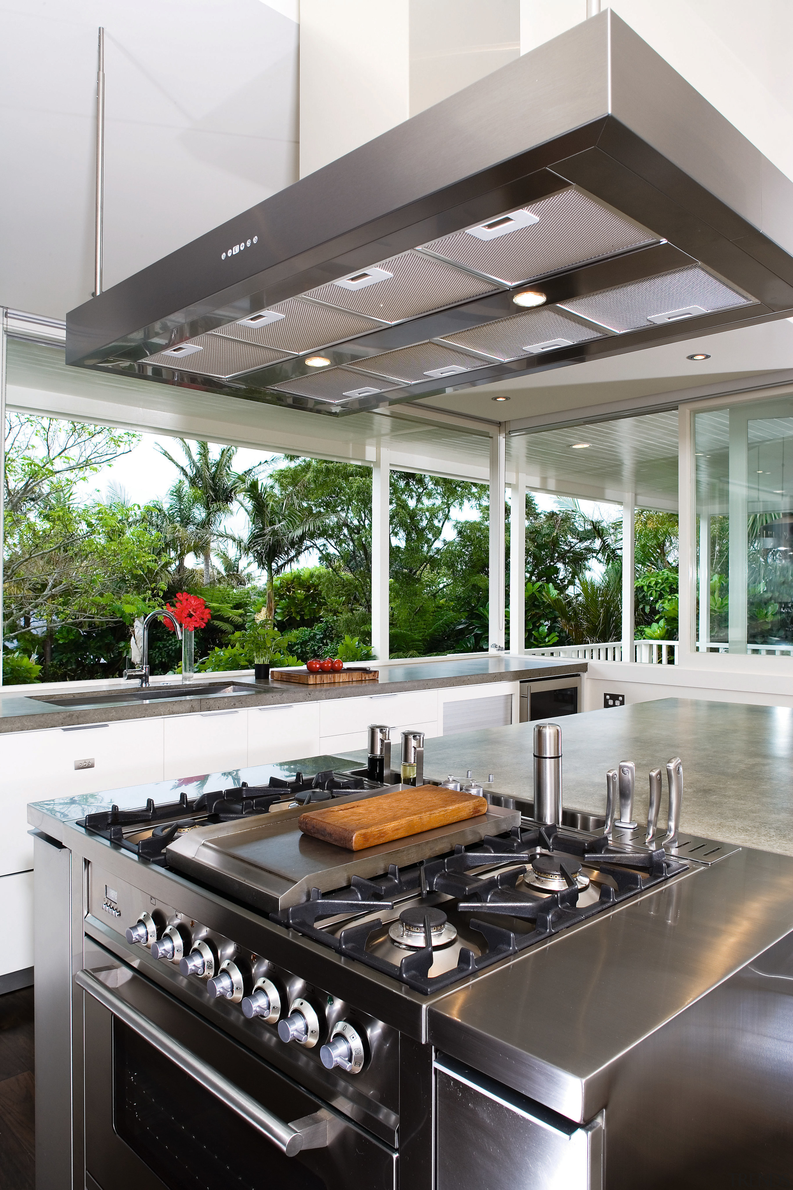 A close up view of the cooktop and countertop, interior design, kitchen, white, gray