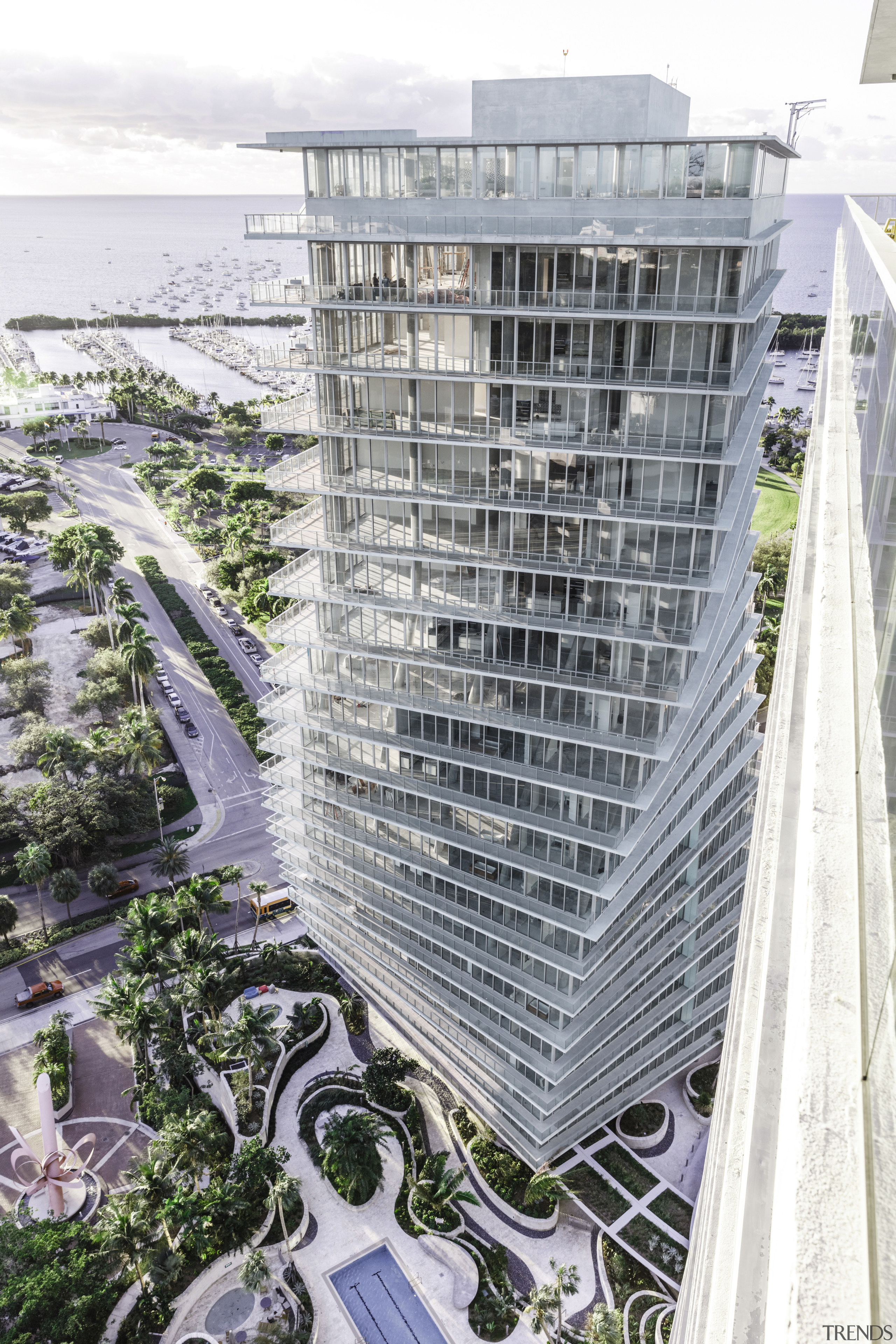 Transparent agenda  floor to ceiling glass in architecture, building, city, condominium, corporate headquarters, headquarters, metropolis, metropolitan area, mixed use, residential area, skyscraper, tower block, urban area, urban design, water, gray, white