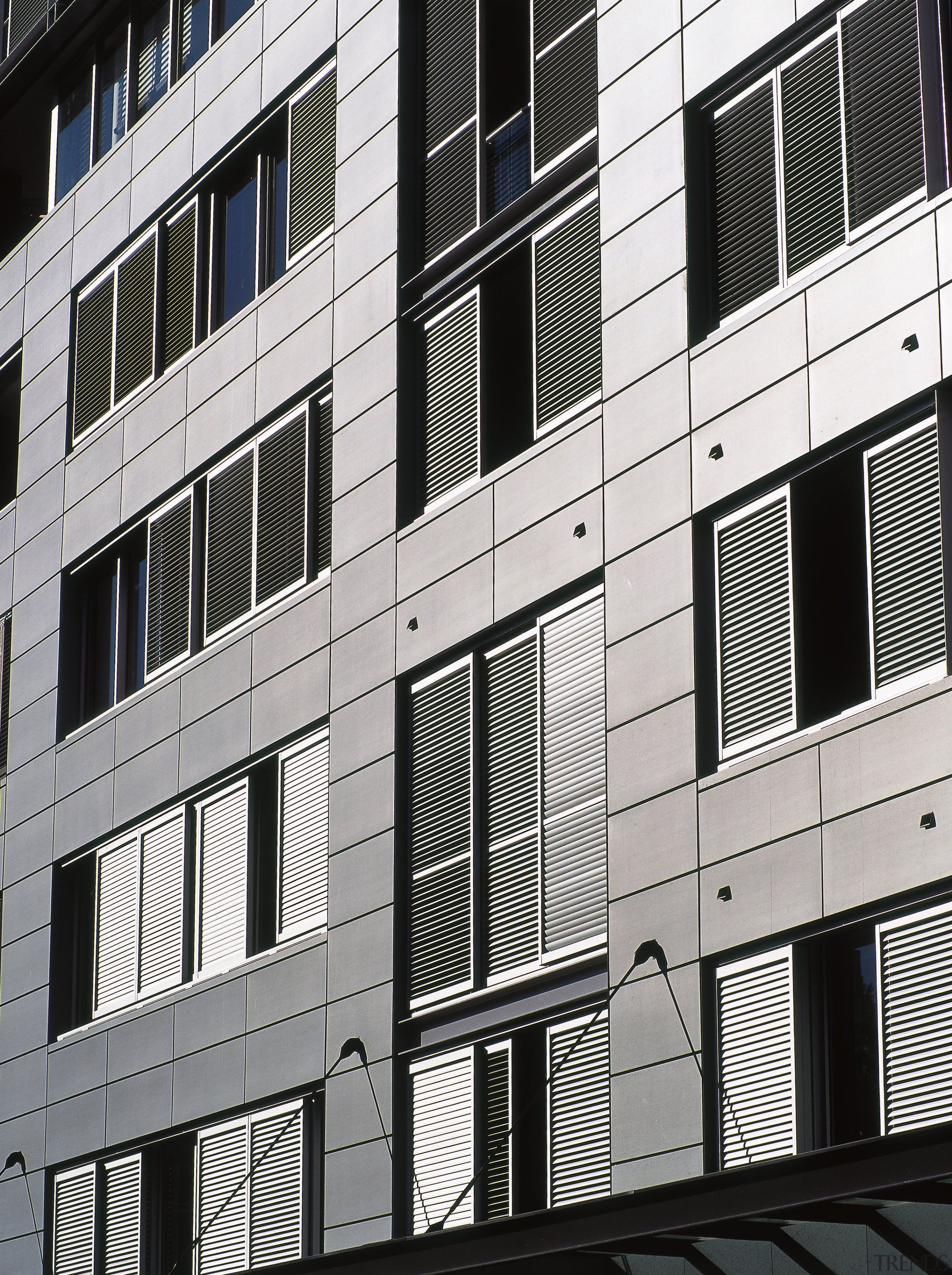 Preweathered zinc cladding panels were used on this apartment, architecture, building, commercial building, condominium, corporate headquarters, daytime, elevation, facade, house, line, metropolis, metropolitan area, residential area, siding, structure, tower block, urban area, window, white, black