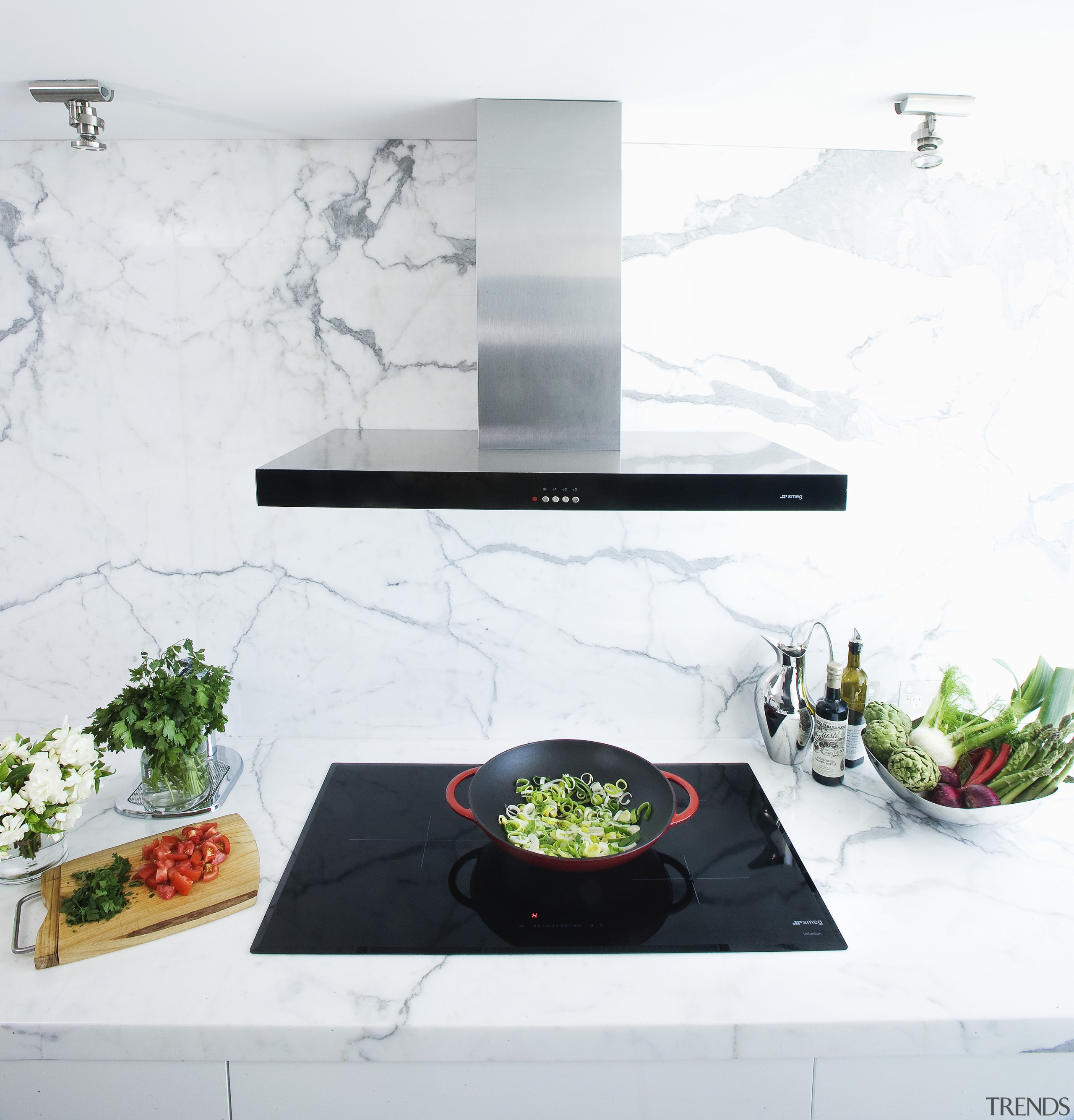 Smeg induction cooktop and wall-mount rangehood on a furniture, interior design, product design, table, white