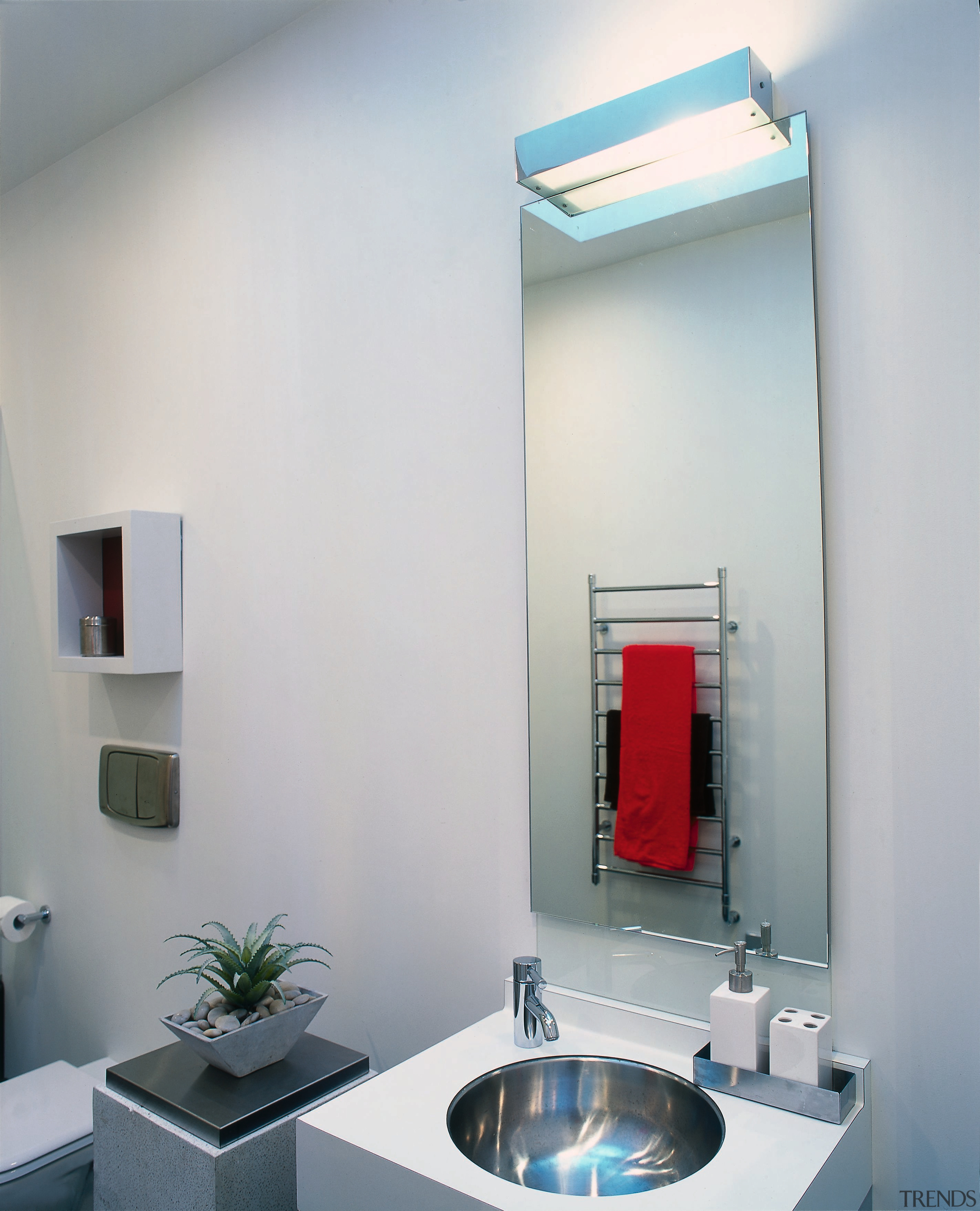The vanity unit and mirror of a bathroom bathroom, bathroom accessory, interior design, lighting, product design, room, gray