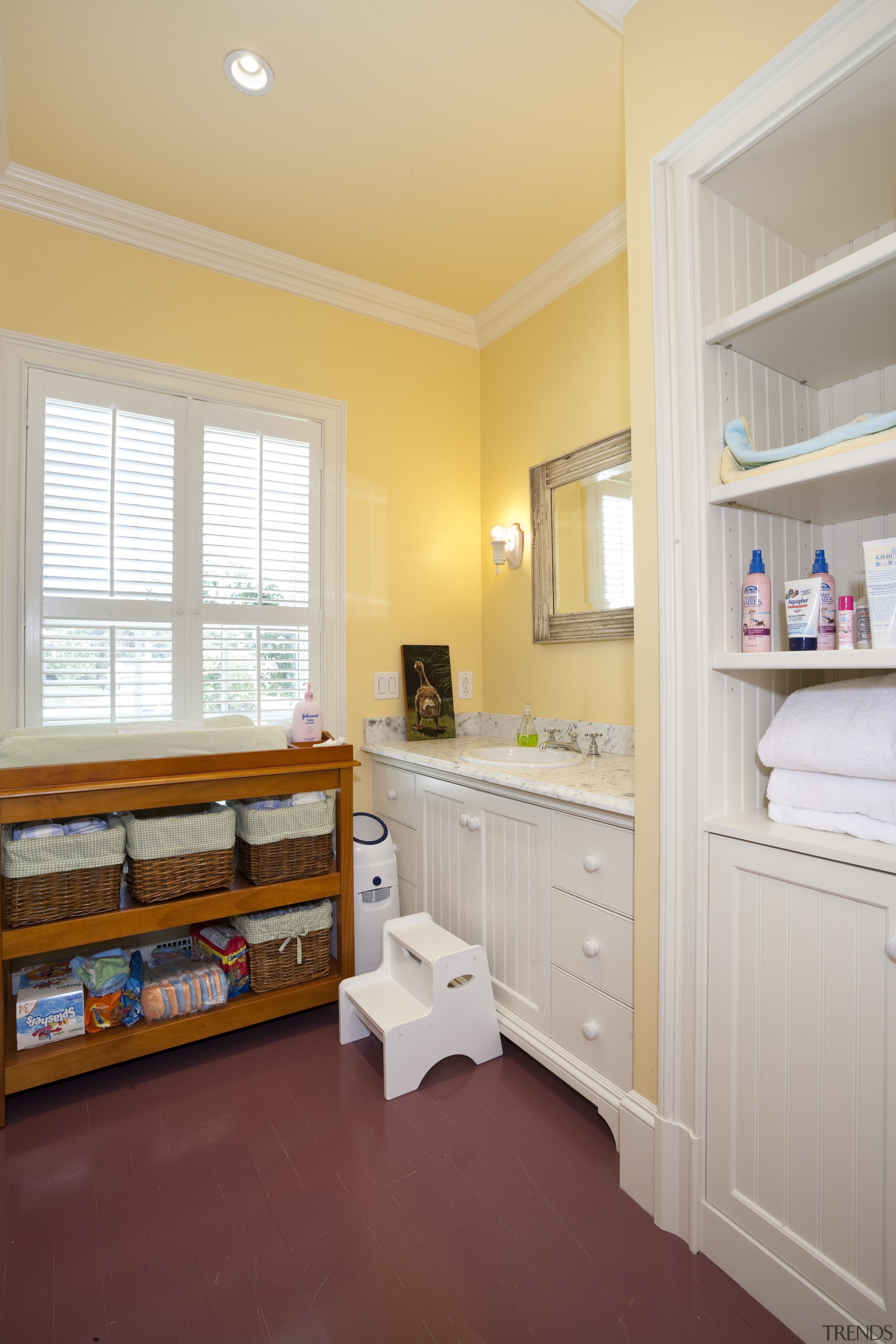 Traditional New England shingle-style homes dot the coastline cabinetry, ceiling, floor, home, interior design, real estate, room, window, wood, gray, orange