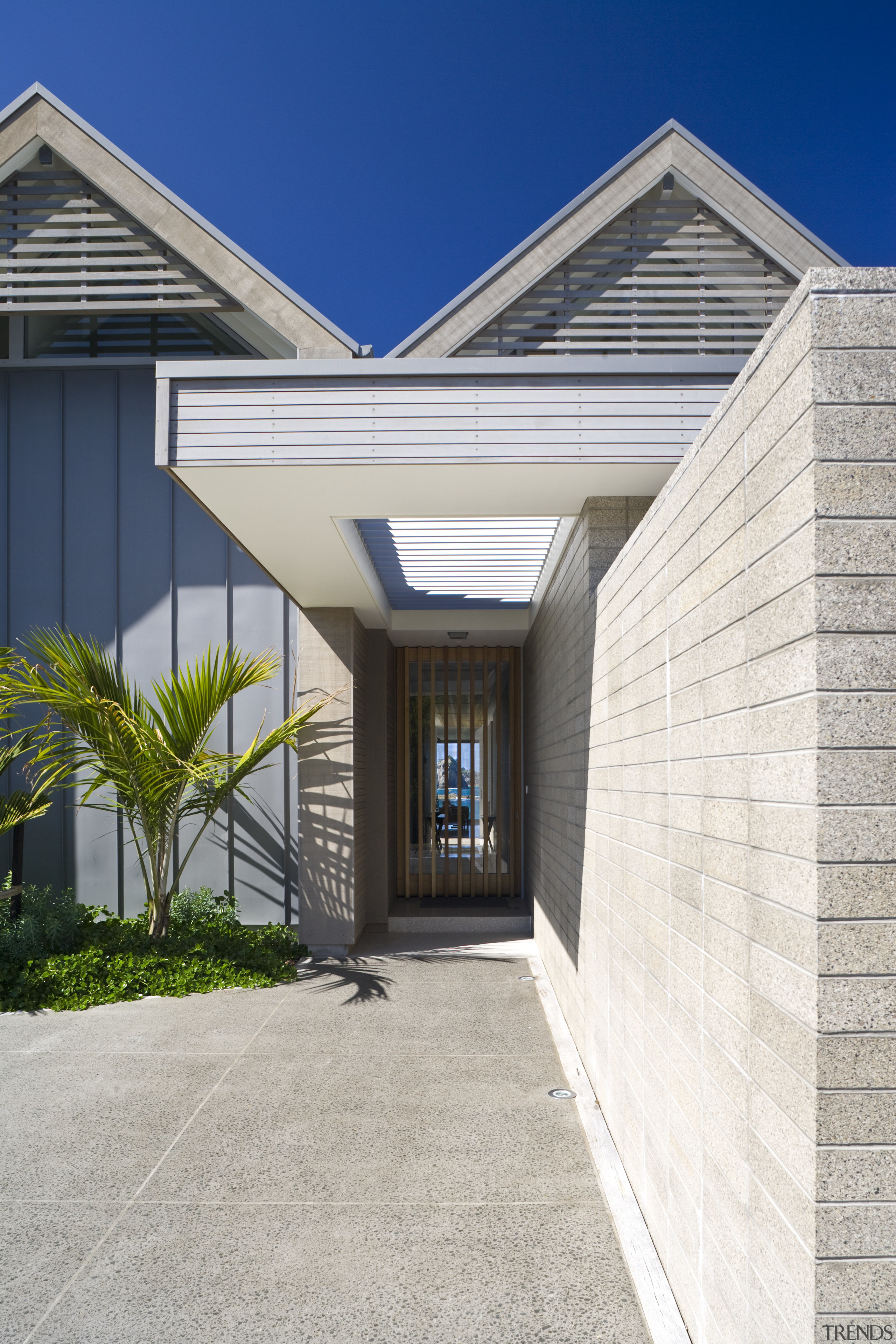 Exterior view of the front entrance which is architecture, building, estate, facade, home, house, property, real estate, residential area, siding, sky, window, white