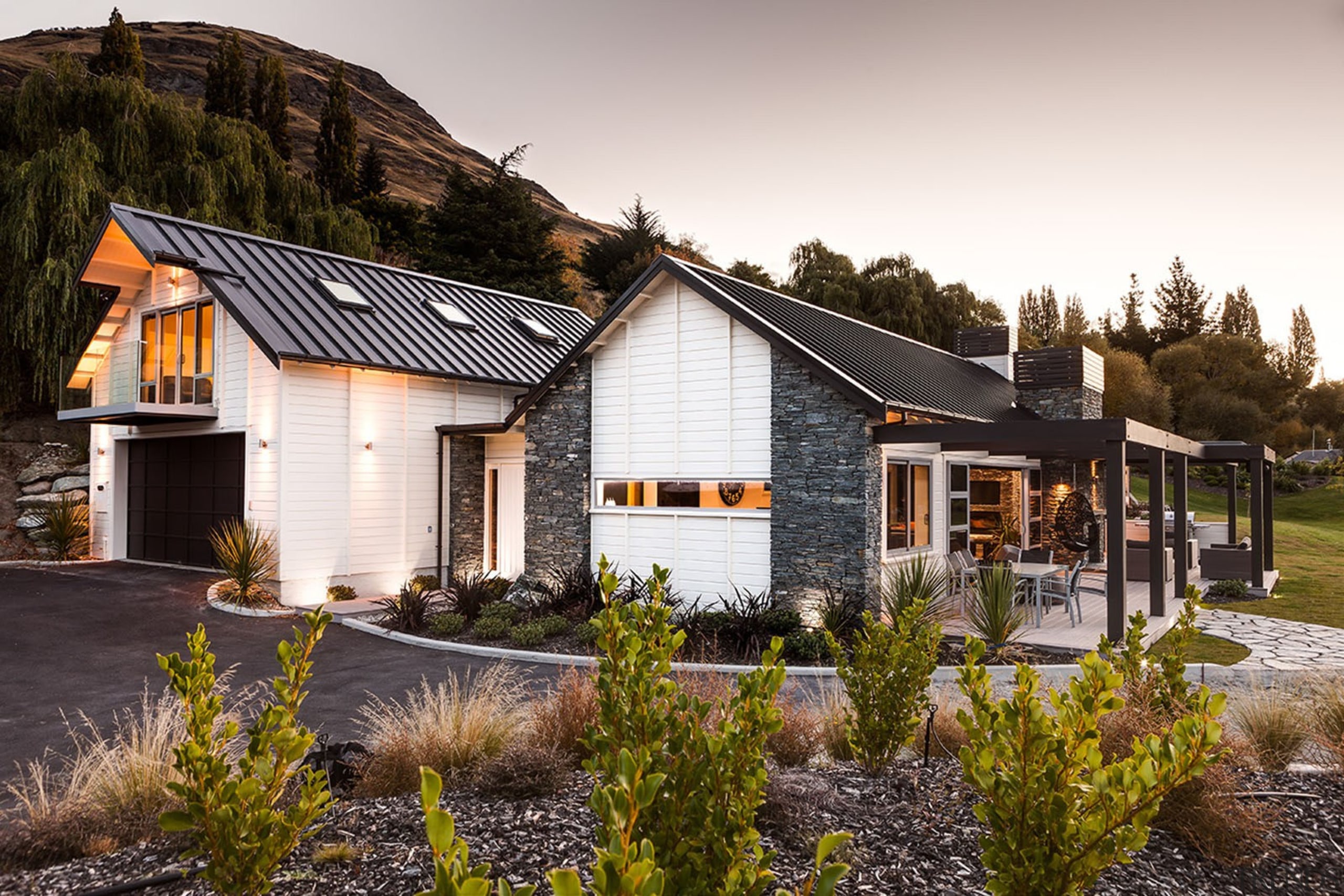 This home is stunning in so many ways. cottage, farmhouse, home, house, landscape, property, real estate, residential area, sky, tree, white, brown