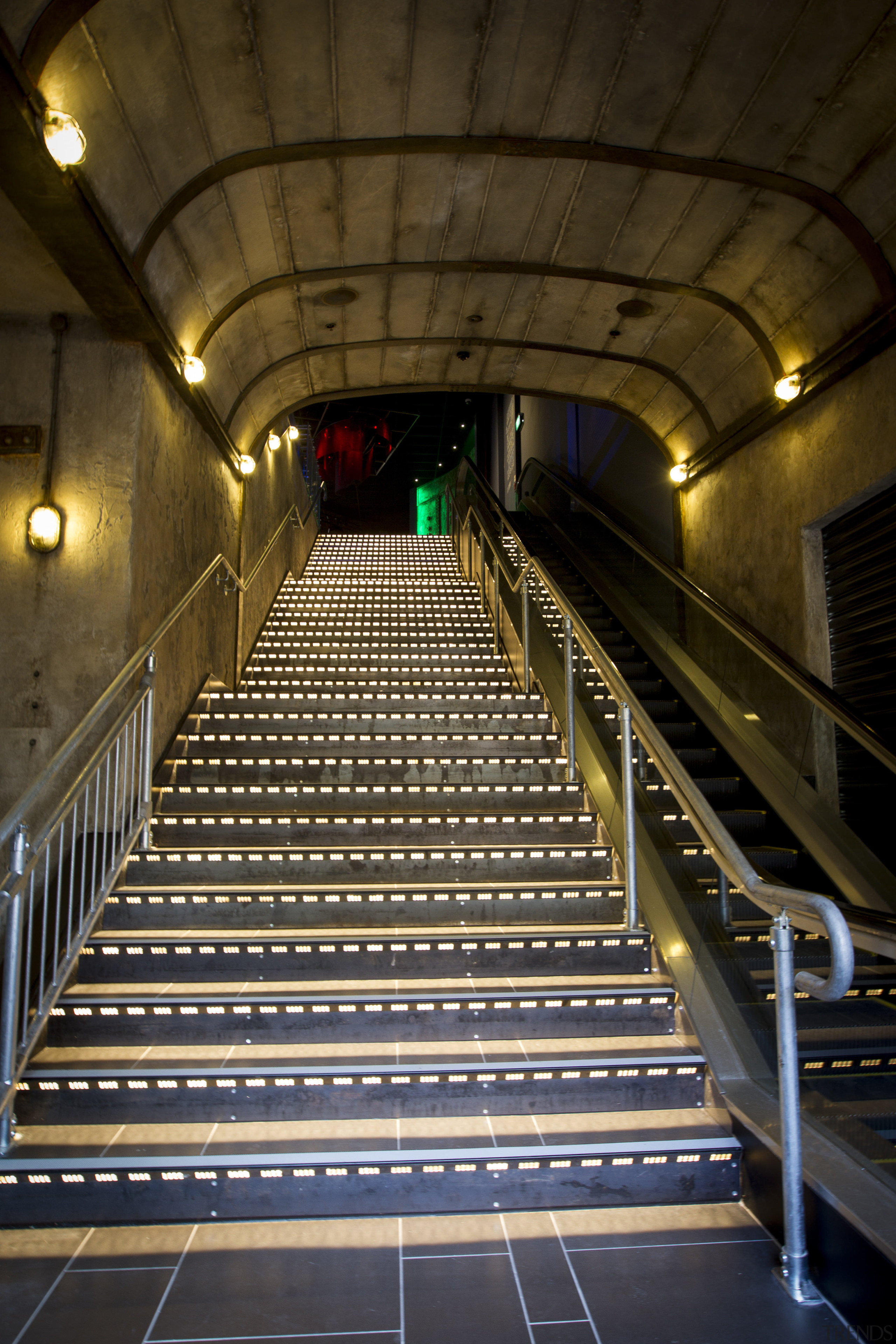 Unique Creative created this barrel-vault ceiling for a architecture, darkness, escalator, infrastructure, light, lighting, metro station, metropolitan area, night, public transport, rapid transit, stairs, subway, tunnel, brown