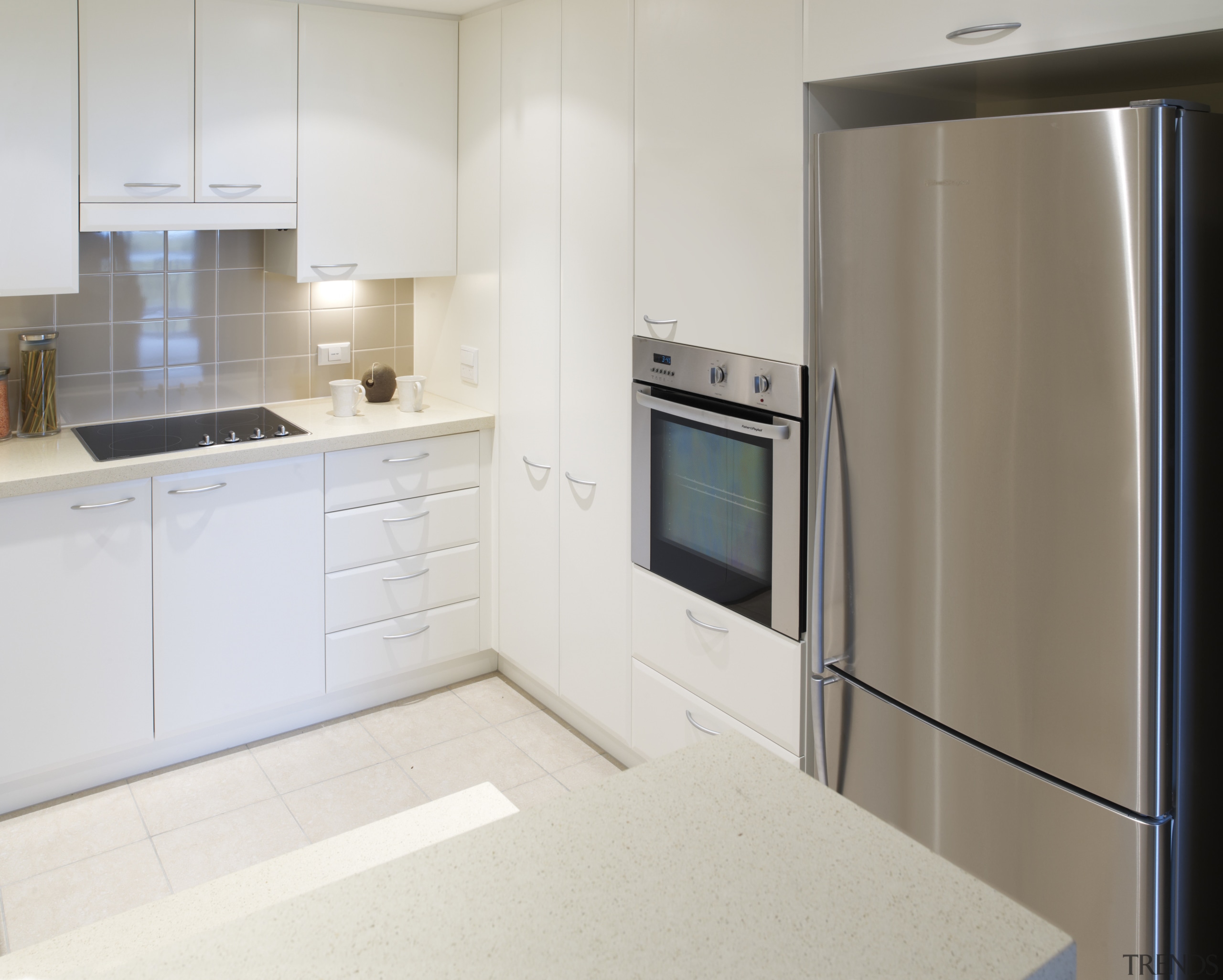 View of the kitchen of a unit at cabinetry, countertop, home appliance, interior design, kitchen, property, real estate, room, white