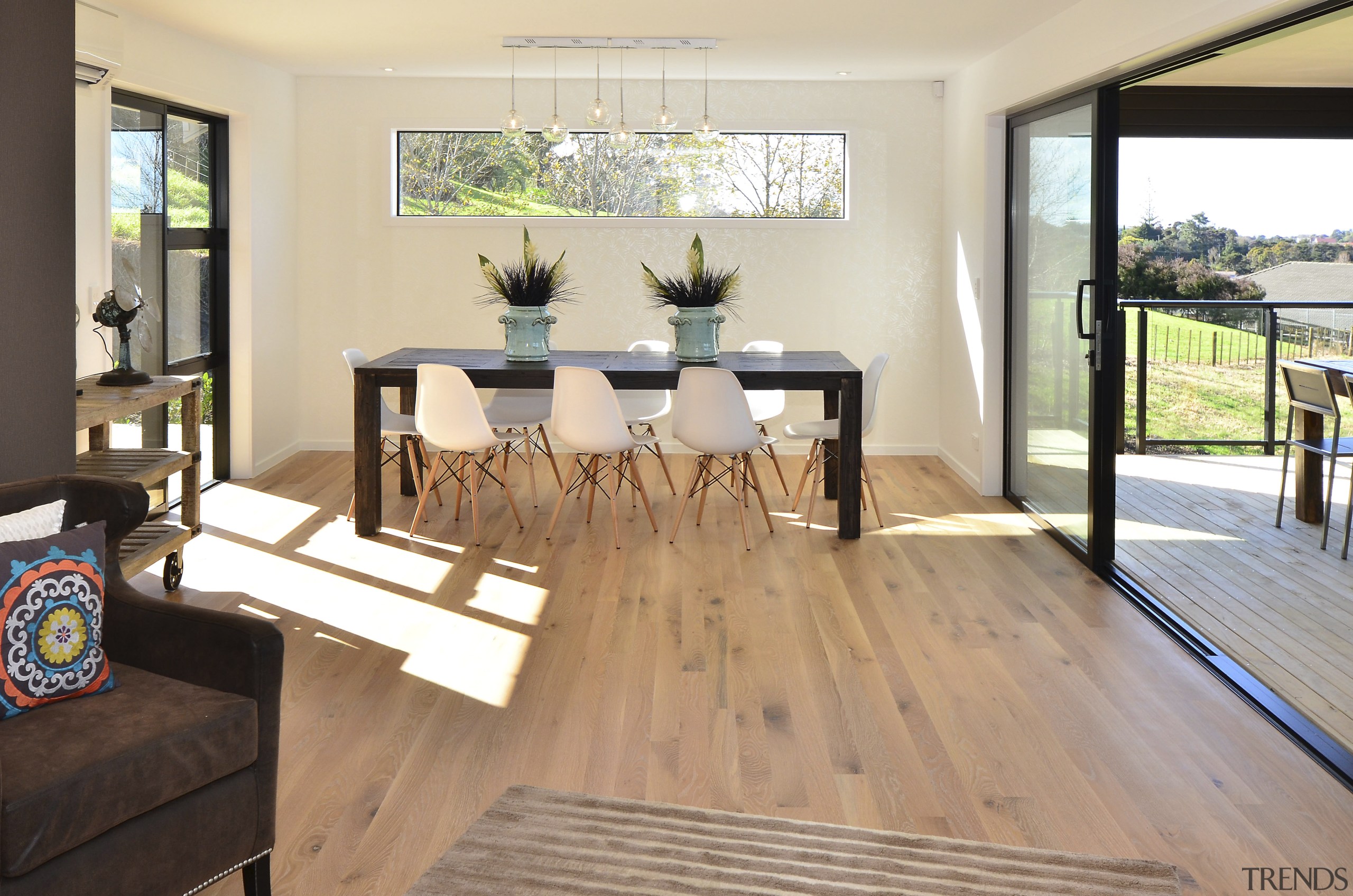 Seen here is a David Reid show home. floor, flooring, hardwood, house, interior design, laminate flooring, living room, real estate, room, table, wood, wood flooring, white