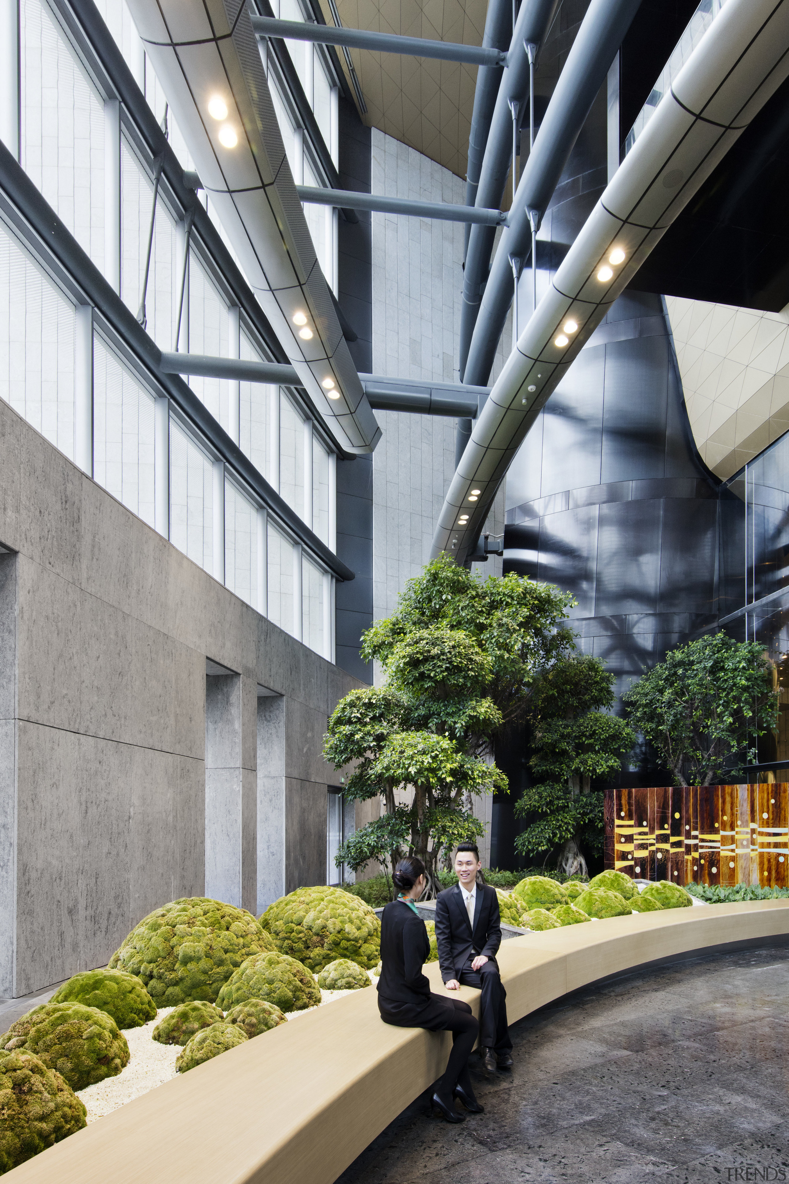 Ground floor lobby space next to the hotel architecture, building, condominium, metropolitan area, mixed use, plant, tourist attraction, tree, gray