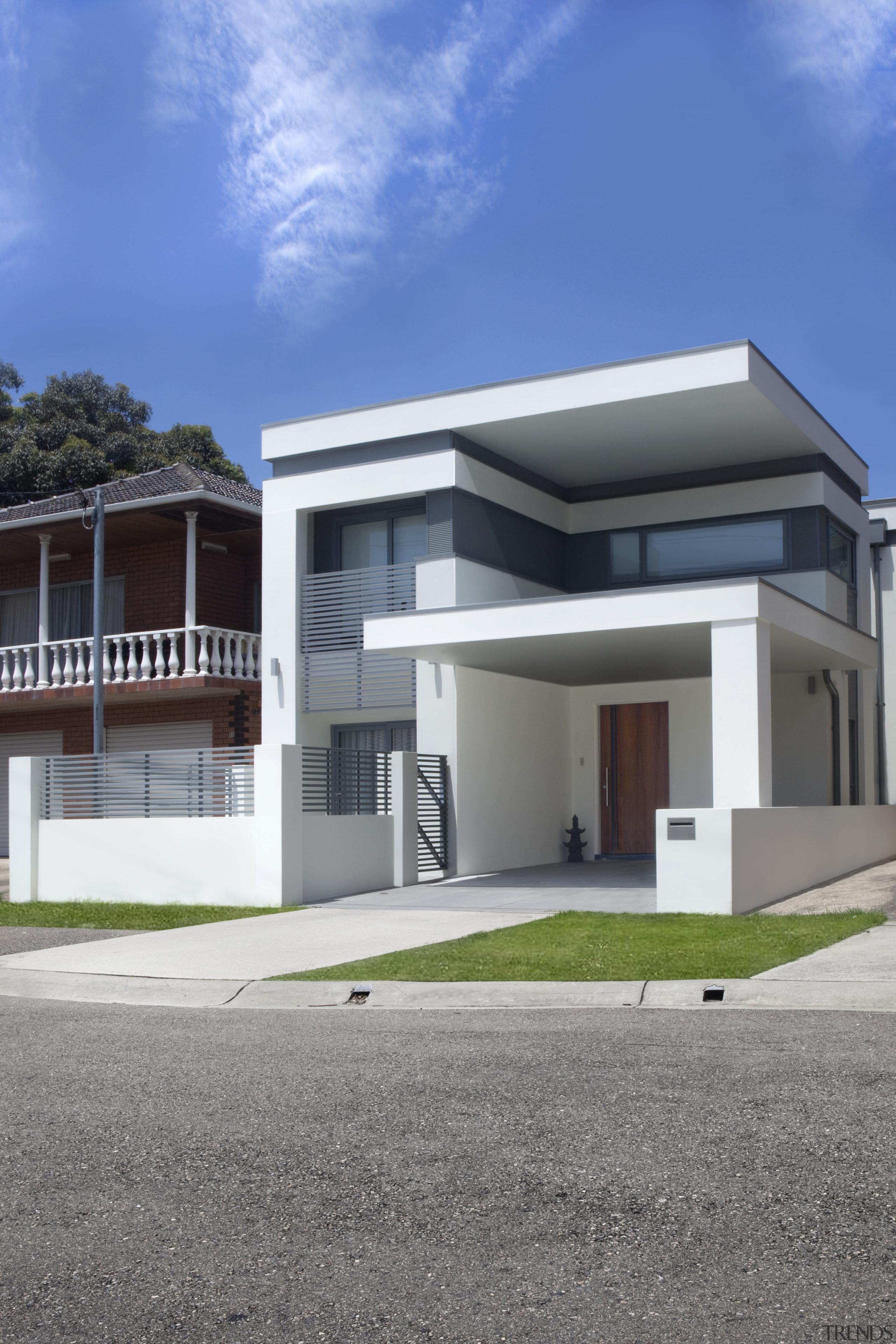 View of contemporary white home. - View of architecture, building, commercial building, elevation, facade, home, house, official residence, property, real estate, residential area, sky, villa, gray, blue
