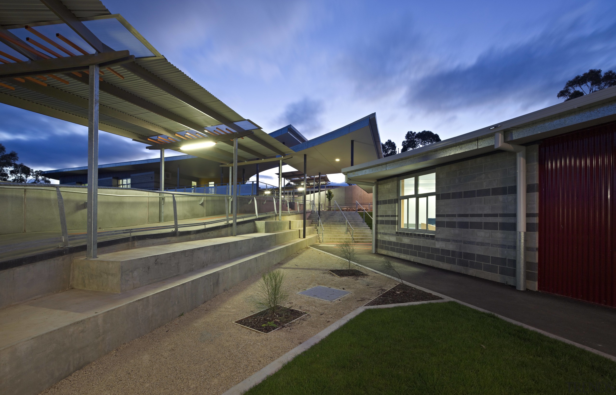 View of exterior of school at dusk. - architecture, estate, home, house, leisure centre, property, real estate, residential area, sky, suburb, brown