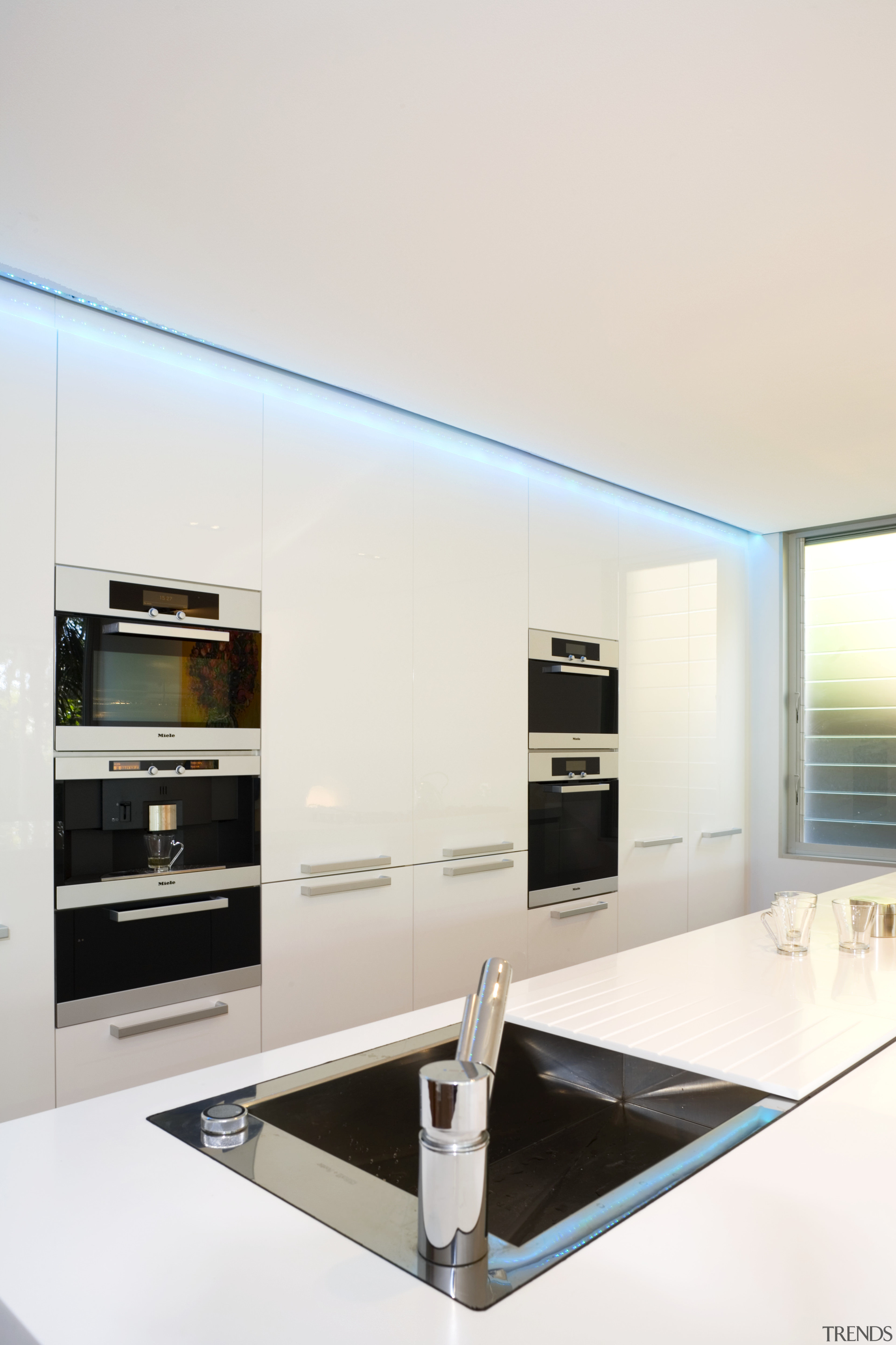 View of kitchen design by Linda Haefeli, and house, interior design, living room, product design, table, white