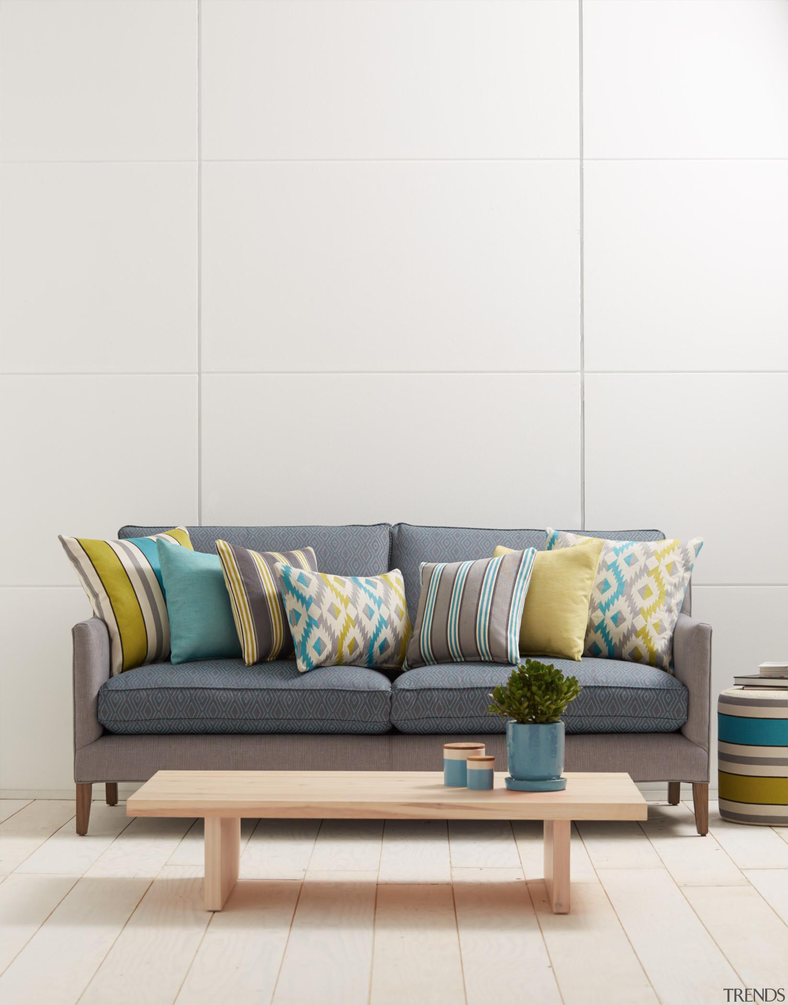 With a Mayan pattern influence, our latest collection couch, floor, furniture, interior design, living room, sofa bed, table, wall, white