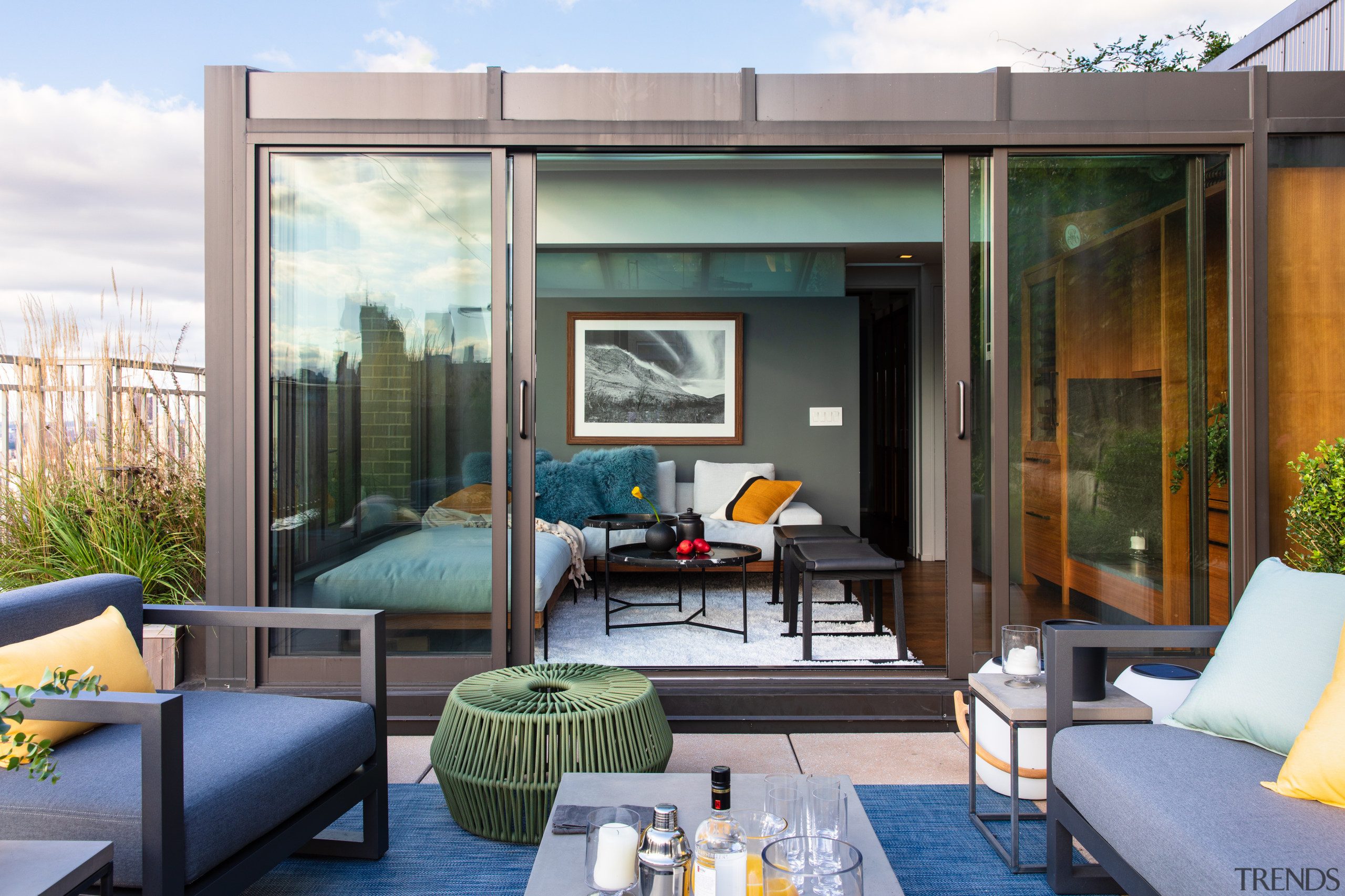 ​​​​​​​Perched on top of a Manhattan duplex, this architecture, penthouse, outdoor deck, outdoor furniture, home, interior design, couch, suite, table, Andrew Wilkinson