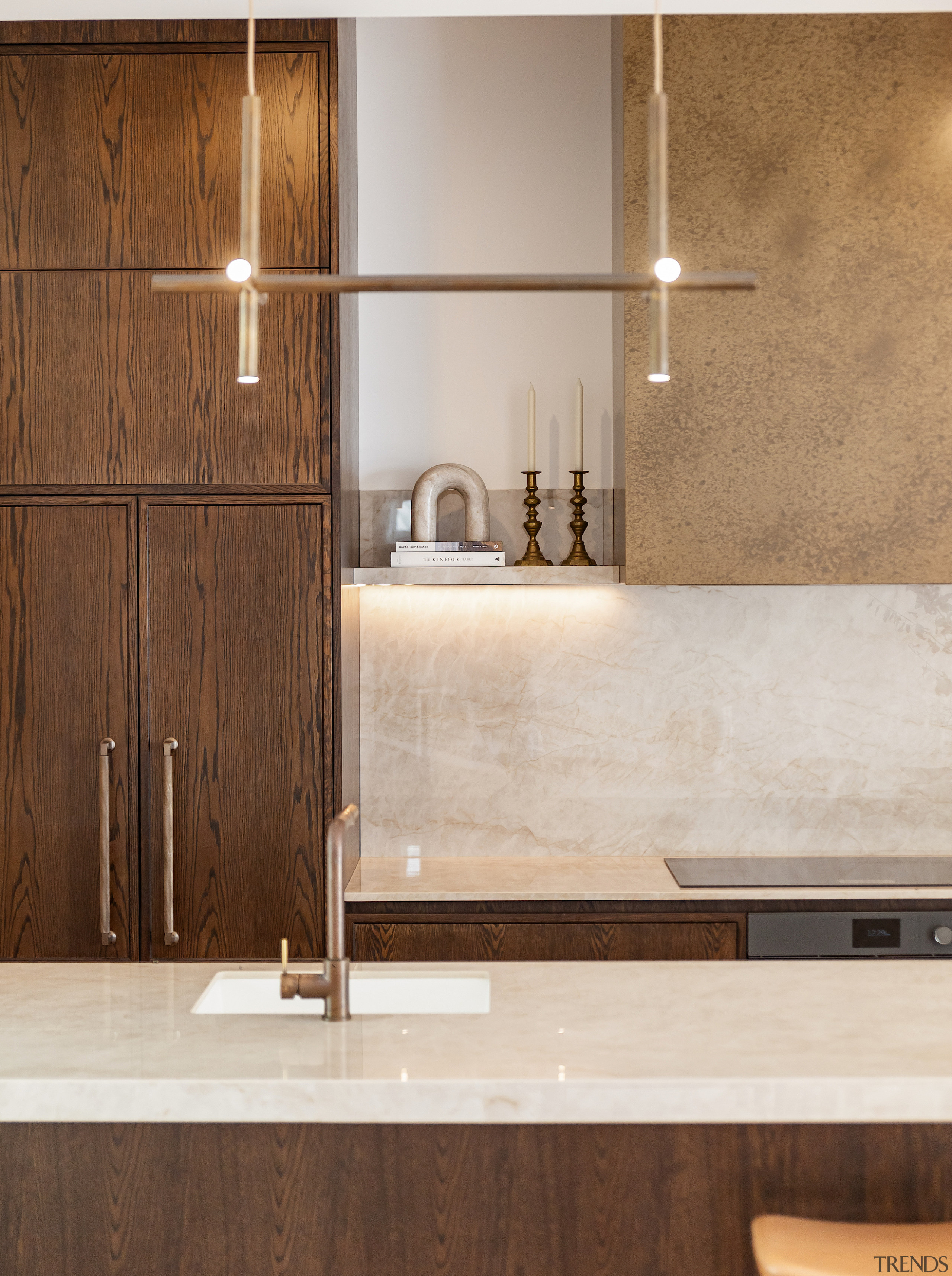 The island pendant has contemporary flair. - Light-hearted 