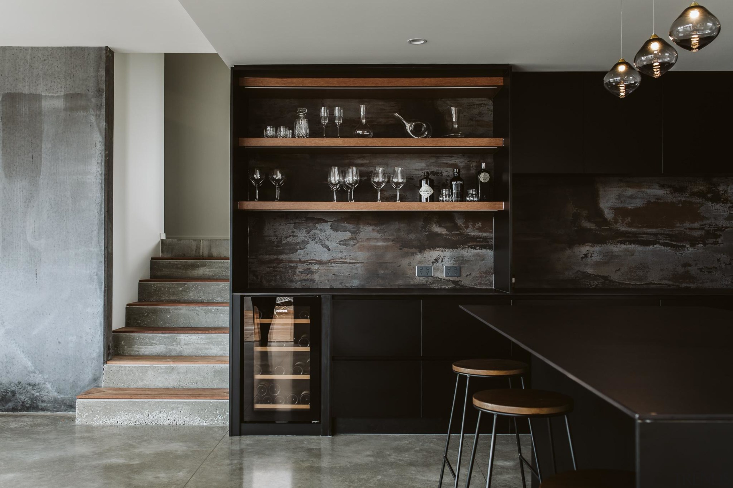 The kitchen's open timber shelving links to the architecture, building, cabinetry, ceiling, countertop, cupboard, floor, flooring, furniture, home, house, interior design, kitchen, property, room, shelf, shelving, tile, wood, black, gray