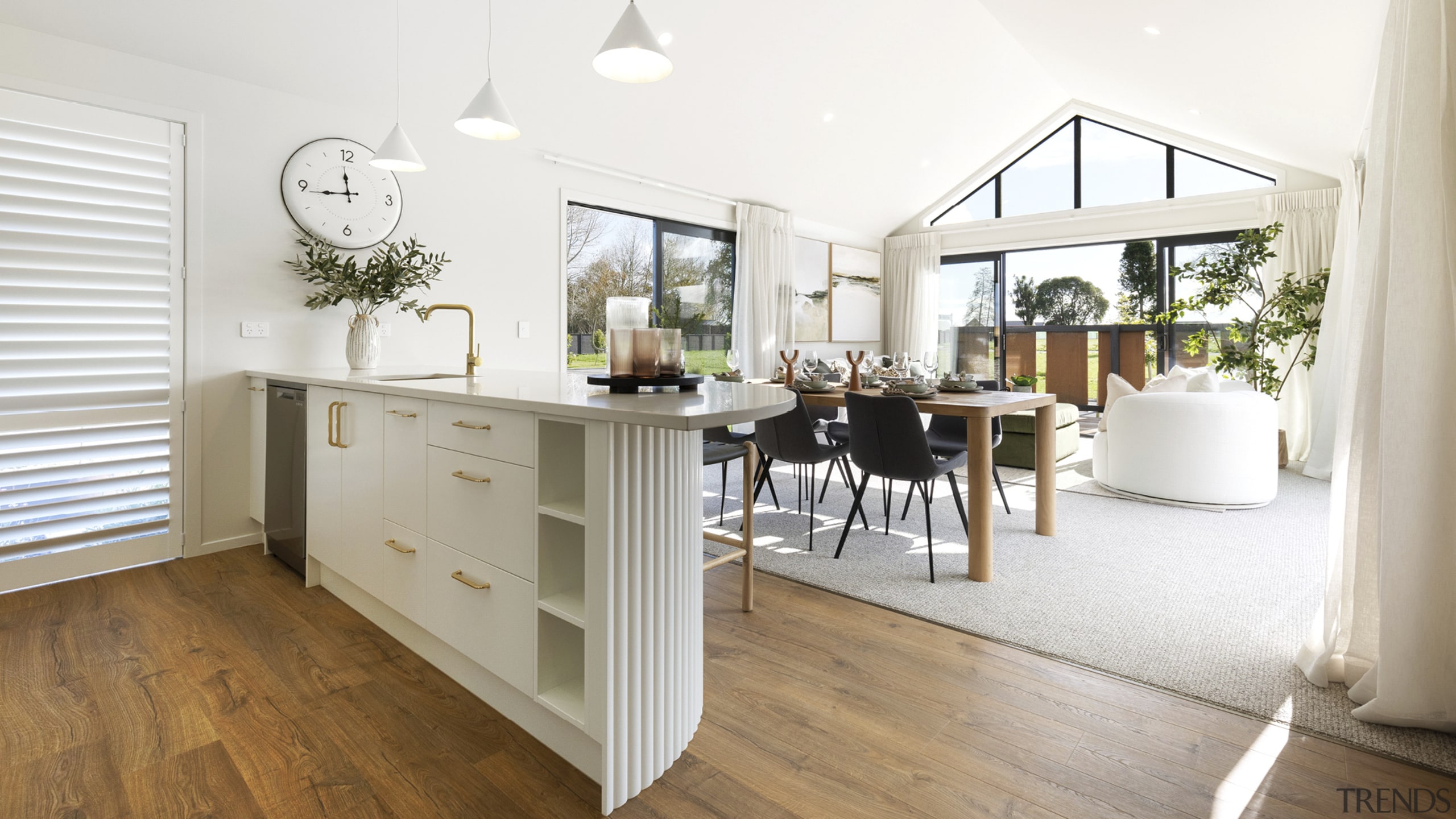 Rich-toned, wood look flooring gives way to cosy 