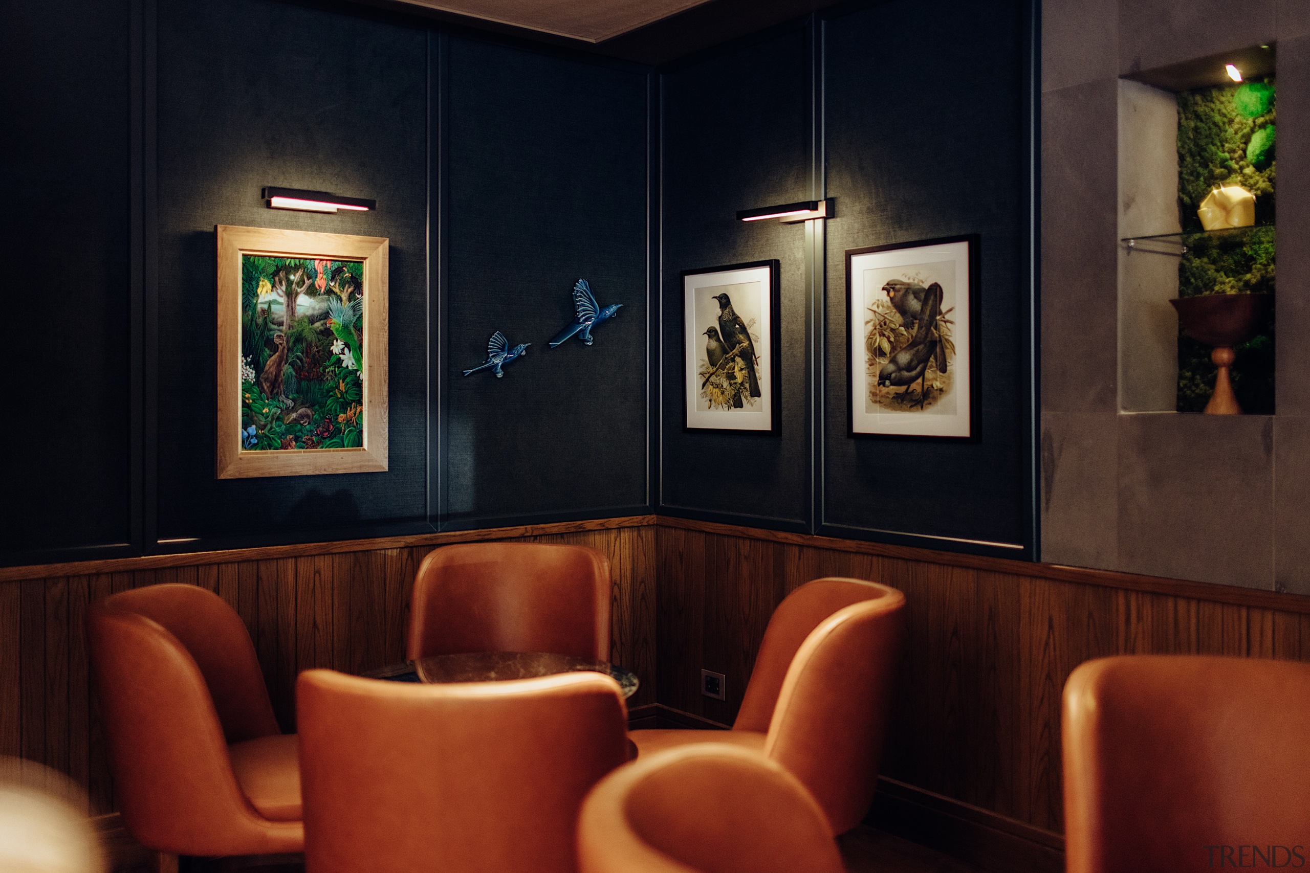 The bar ambience is dark and refined, with 