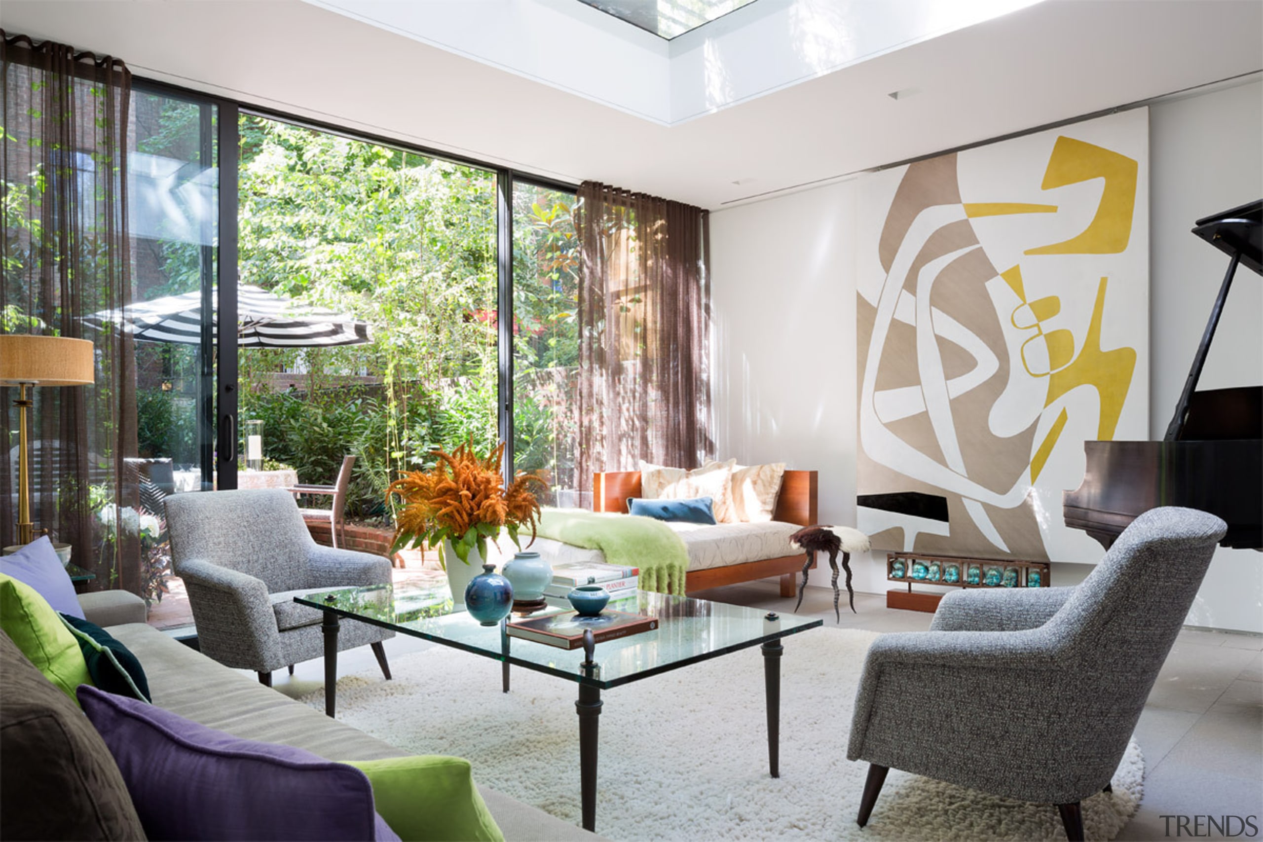 This new addition ties the dining area to ceiling, furniture, home, interior design, living room, real estate, room, wall, window, gray