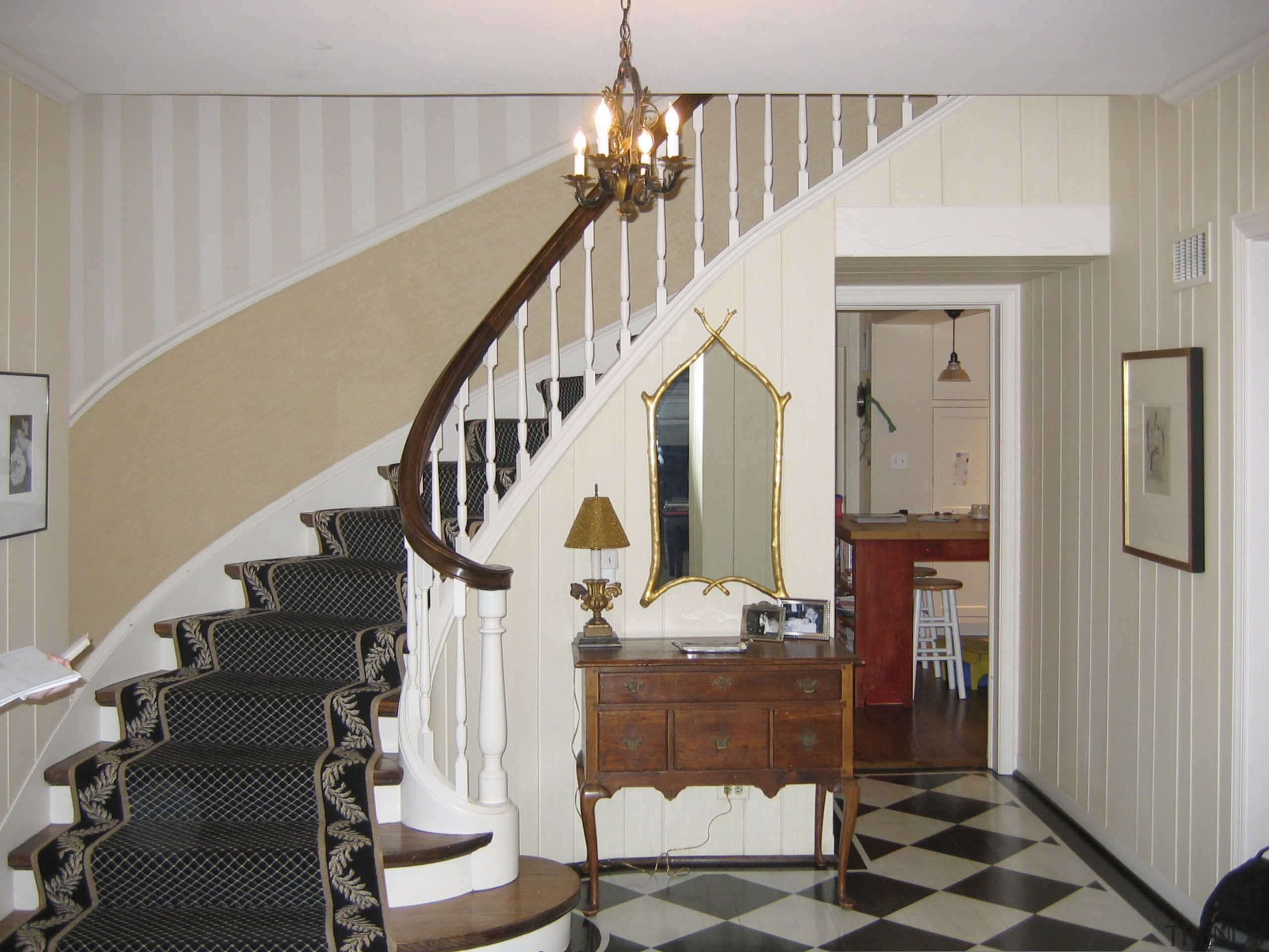 View of the stairway in this traditional house baluster, ceiling, floor, flooring, handrail, home, interior design, real estate, room, stairs, wall, gray
