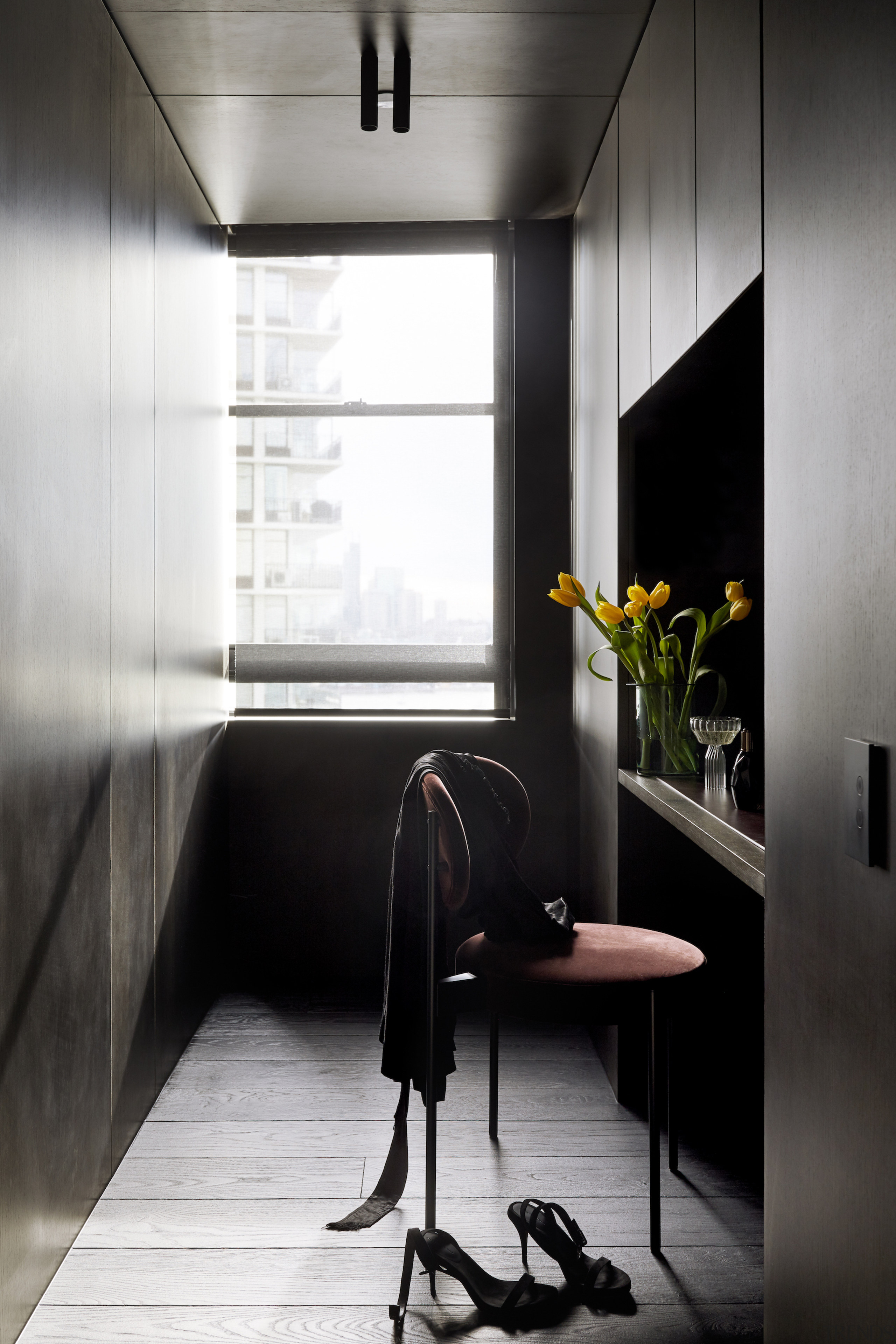 The master suite dressing area has a moody 