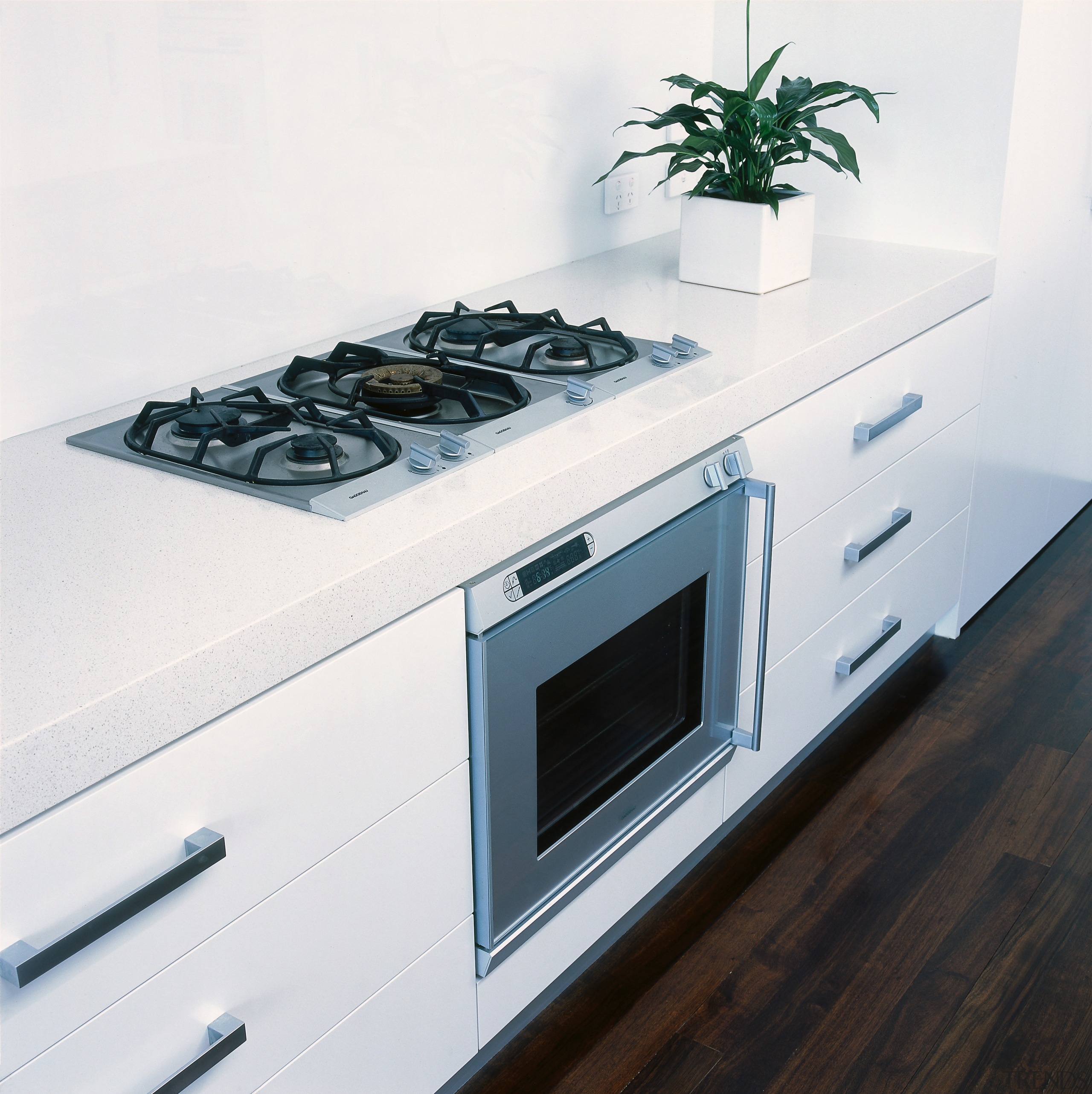 View of a kitchen area, white cabinetry, wooden countertop, gas stove, home appliance, kitchen, kitchen appliance, kitchen stove, major appliance, product design, white