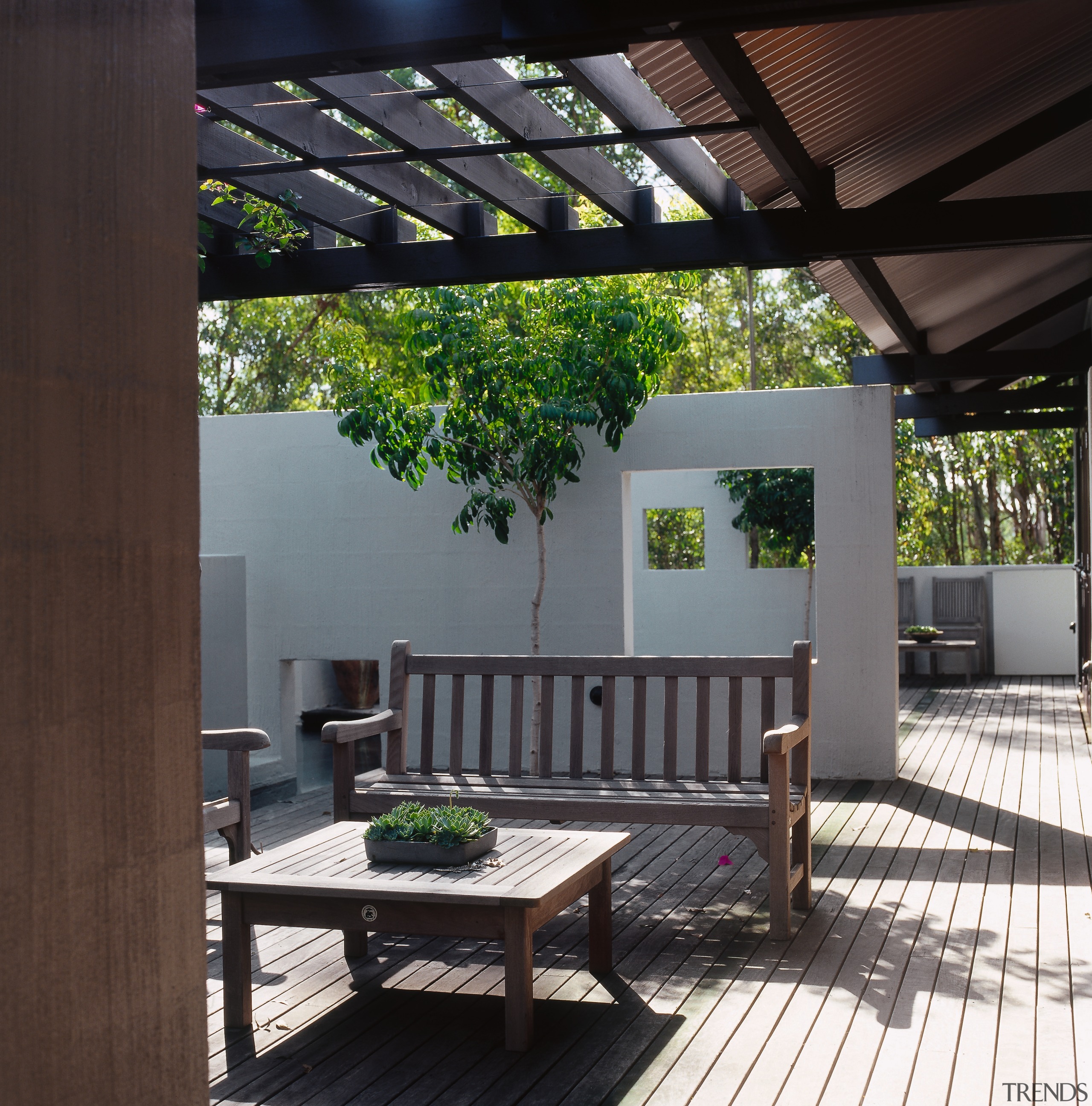 Exterior view of the decking area, concrete wall backyard, courtyard, house, outdoor structure, patio, pergola, black