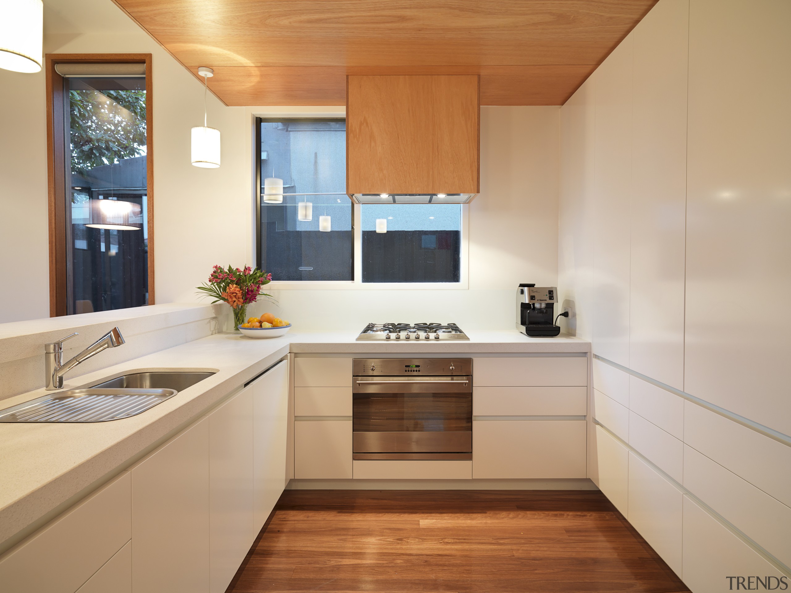 View of kitchen area featuring stone benchotops, lowered architecture, cabinetry, countertop, cuisine classique, interior design, kitchen, real estate, room, orange, gray