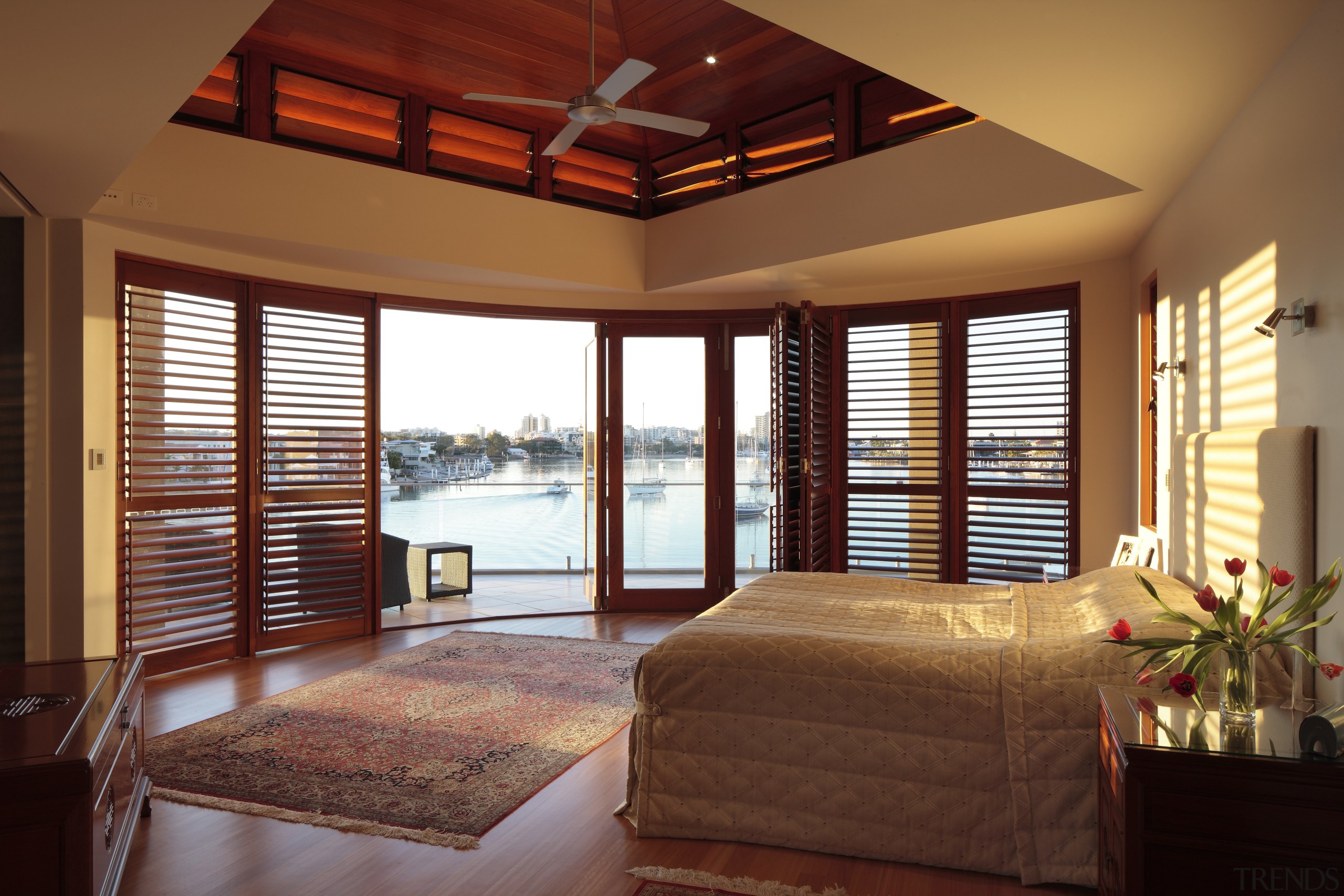 View of the bedroom of this contemporary home bedroom, ceiling, daylighting, door, estate, home, interior design, real estate, room, suite, window, window blind, window covering, window treatment, wood, brown, red