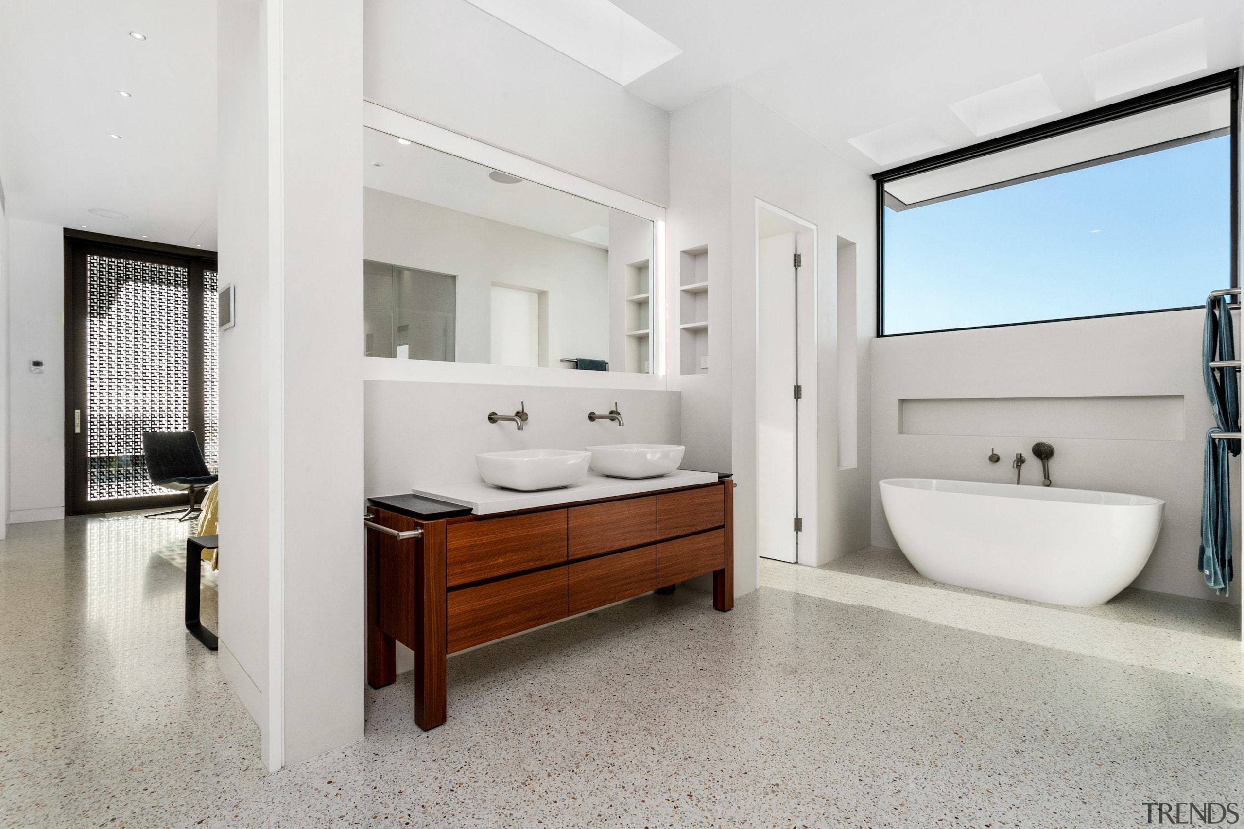 The main ensuite takes cues from this home’s 