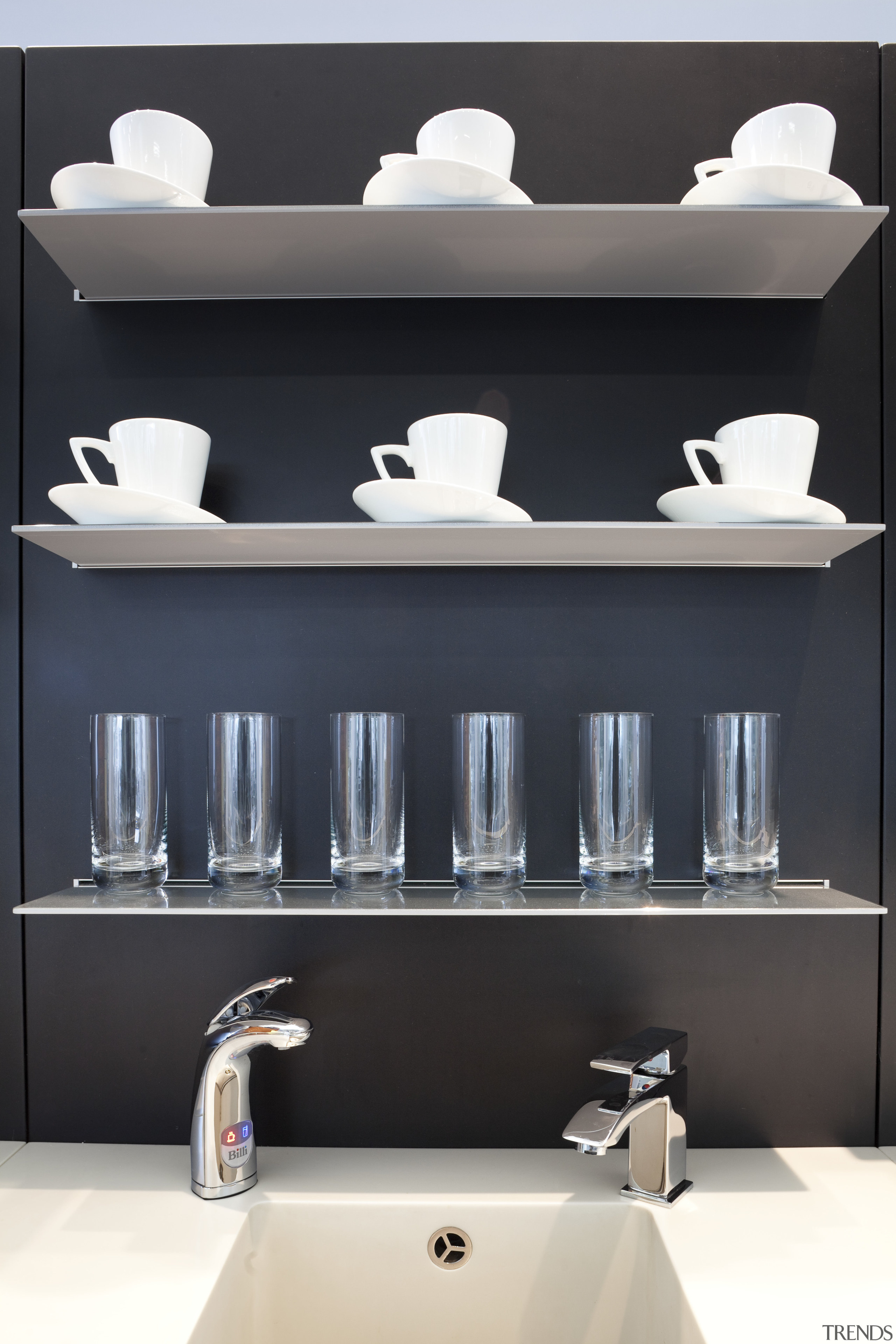Seen here is a drinking-water system designed by bathroom, bathroom accessory, bathroom cabinet, furniture, interior design, plumbing fixture, product design, shelf, shelving, sink, tap, wall, black, white
