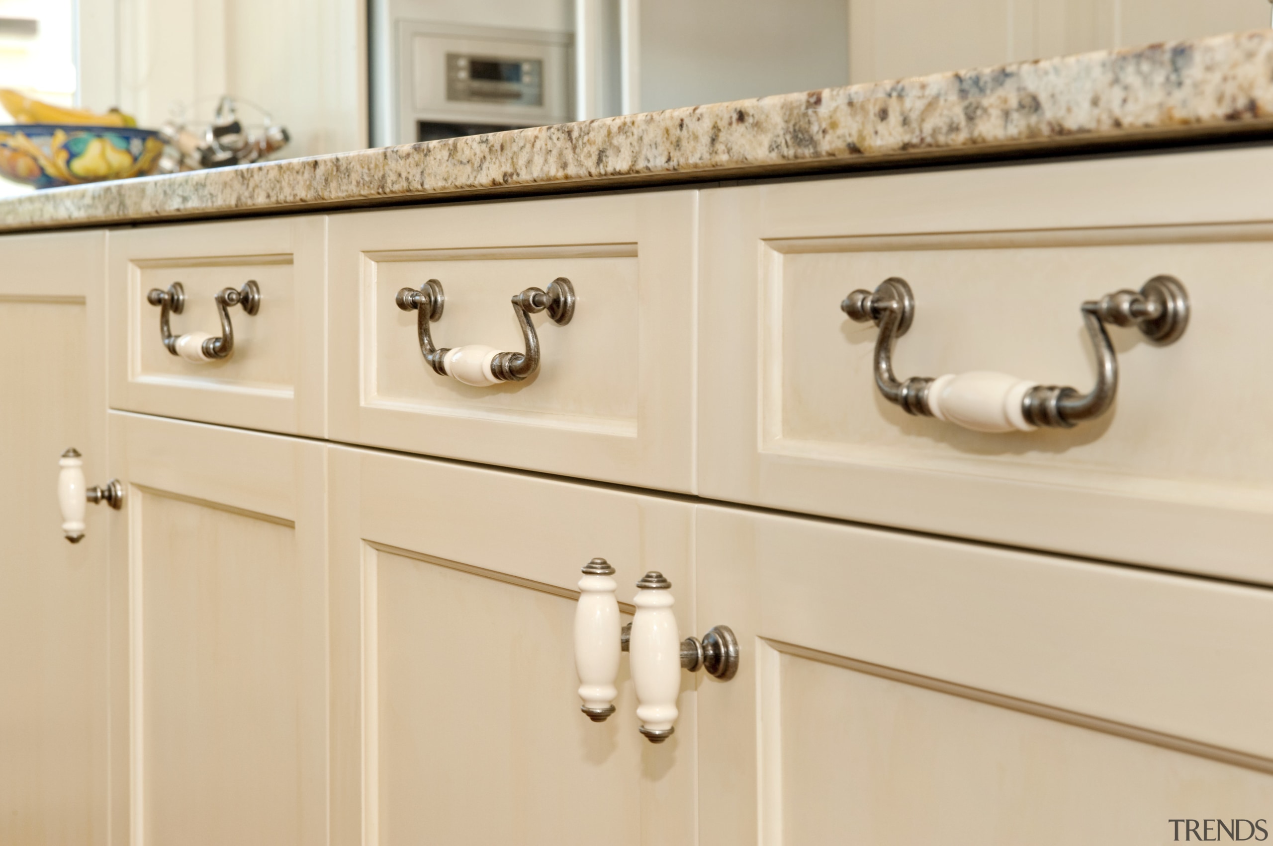 The kitchen, also by Fyfe Kitchens, features traditional bathroom accessory, bathroom cabinet, cabinetry, chest of drawers, countertop, drawer, furniture, room, shelf, sink, tap, wood stain, orange