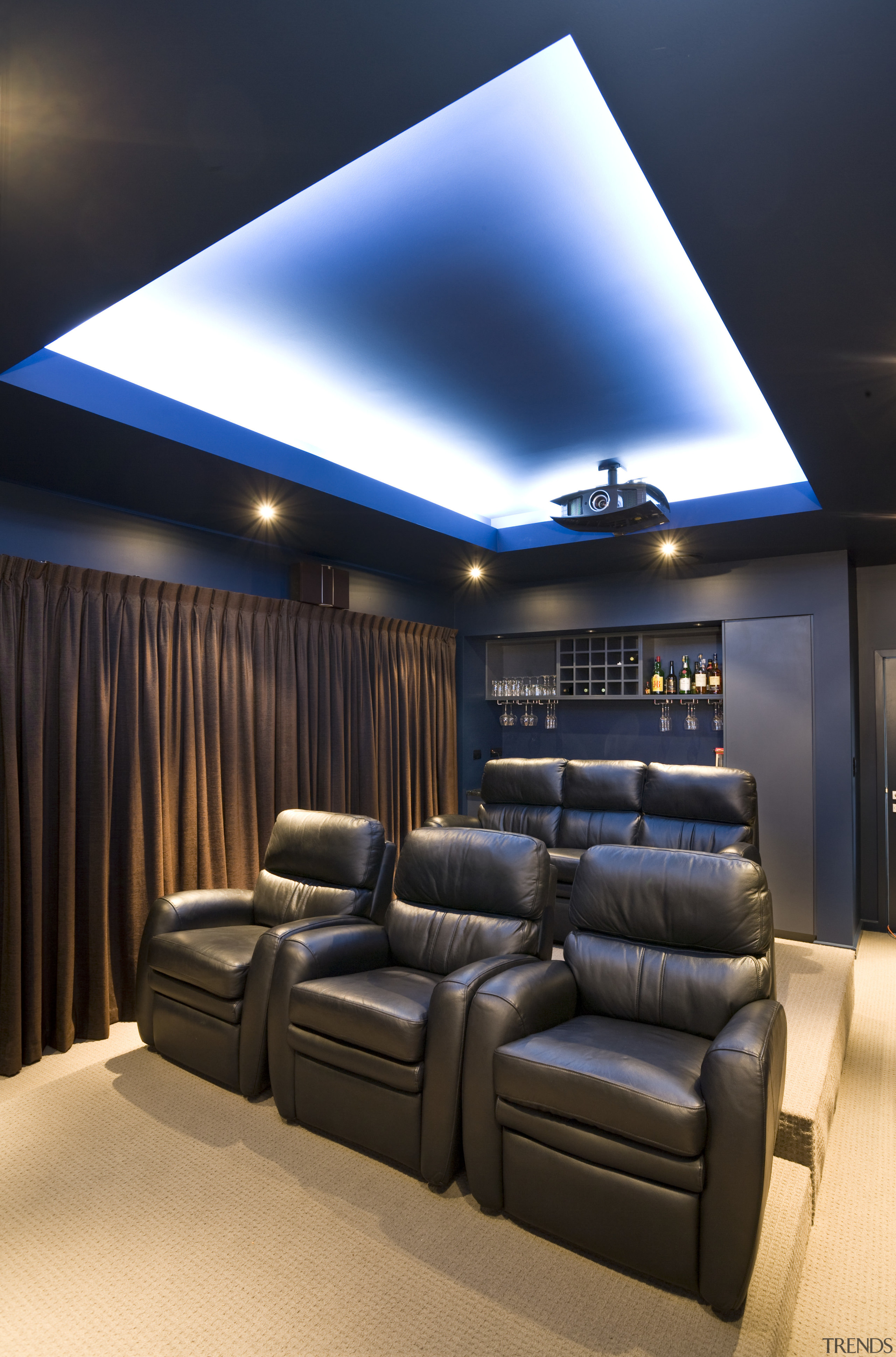 View of a home theatre with screen, projector, ceiling, interior design, lighting, black