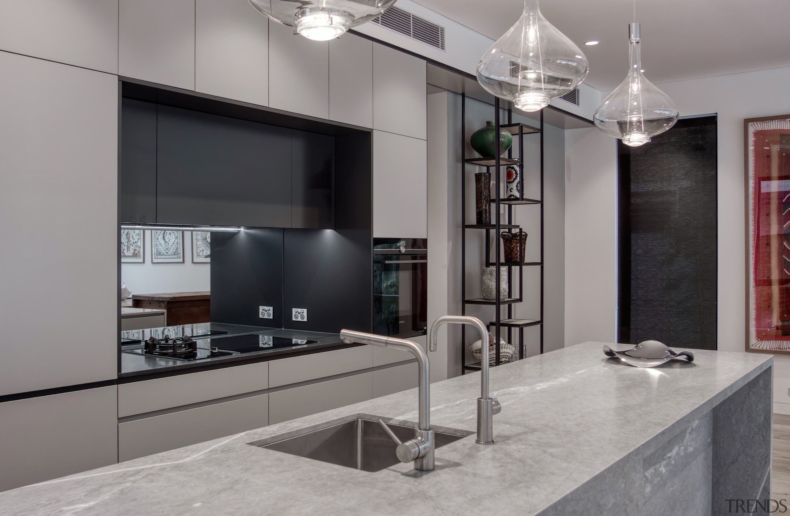 A mirror splashback adds to the sense of 