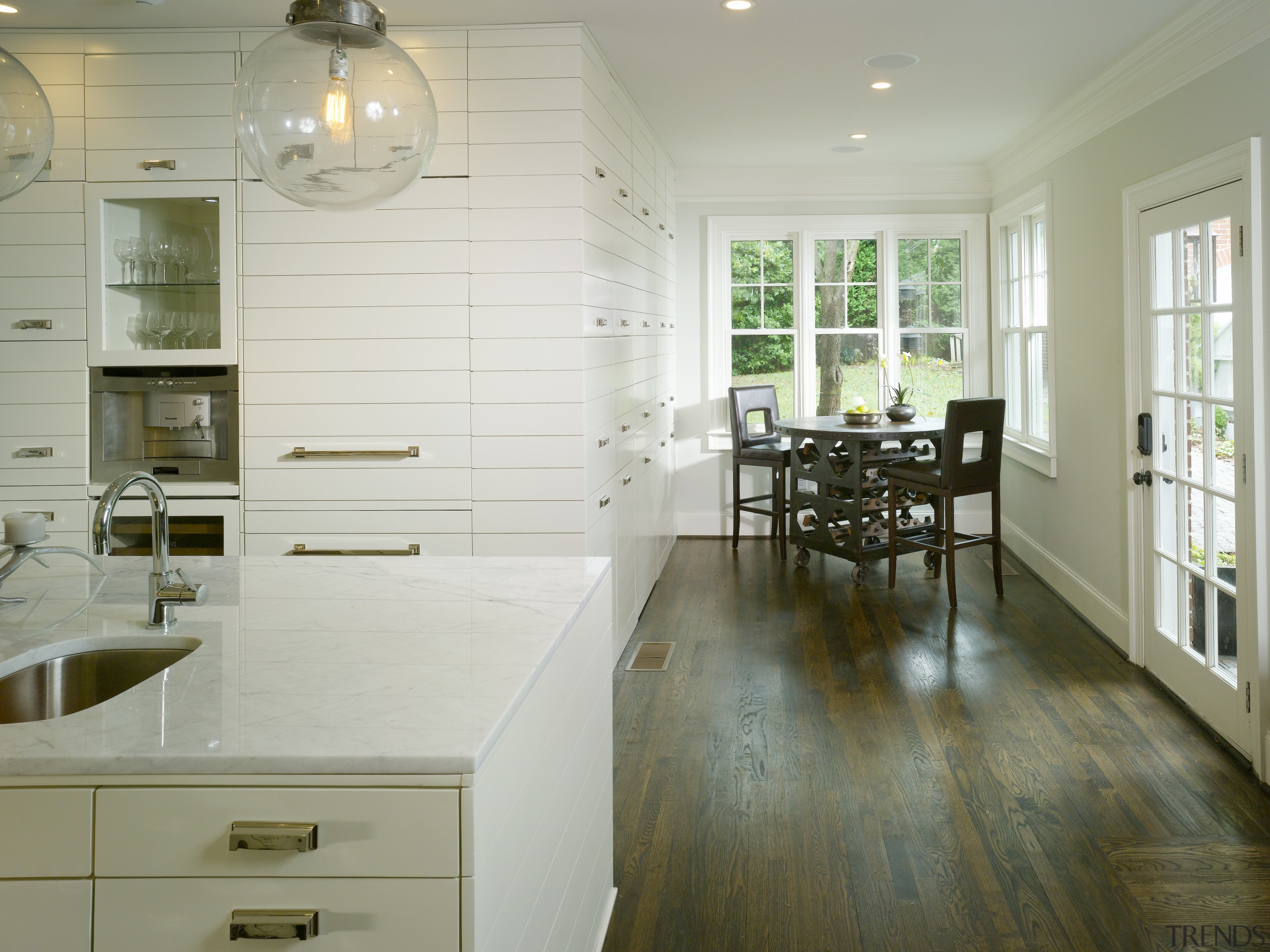 View of kitchen by Designer Willis Watts. Remodelled cabinetry, countertop, cuisine classique, floor, flooring, hardwood, home, interior design, kitchen, laminate flooring, room, tile, wood, wood flooring, gray