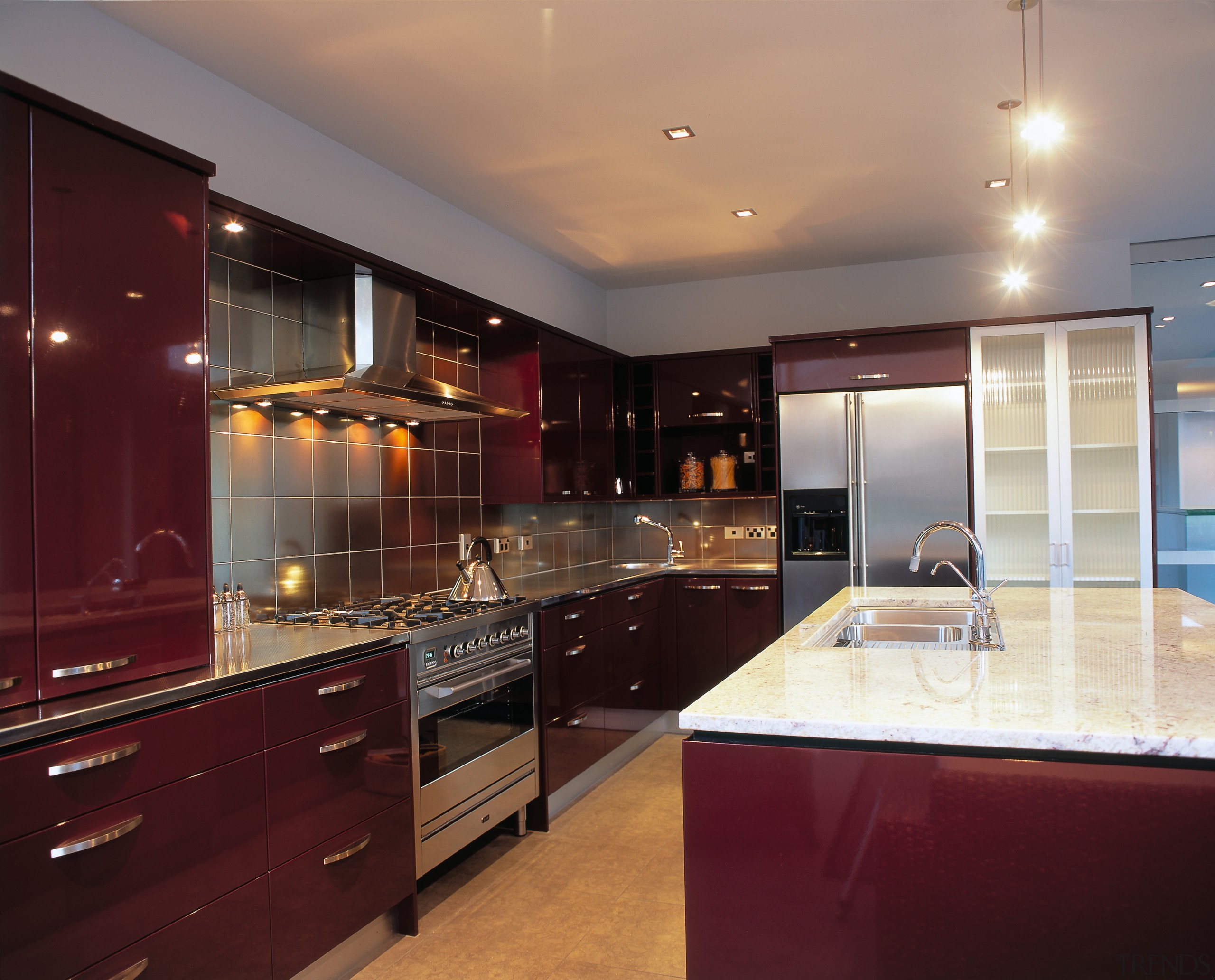 Kitchen with red brown cabinetry, stainless steel appliances cabinetry, ceiling, countertop, cuisine classique, interior design, kitchen, real estate, room, under cabinet lighting, red