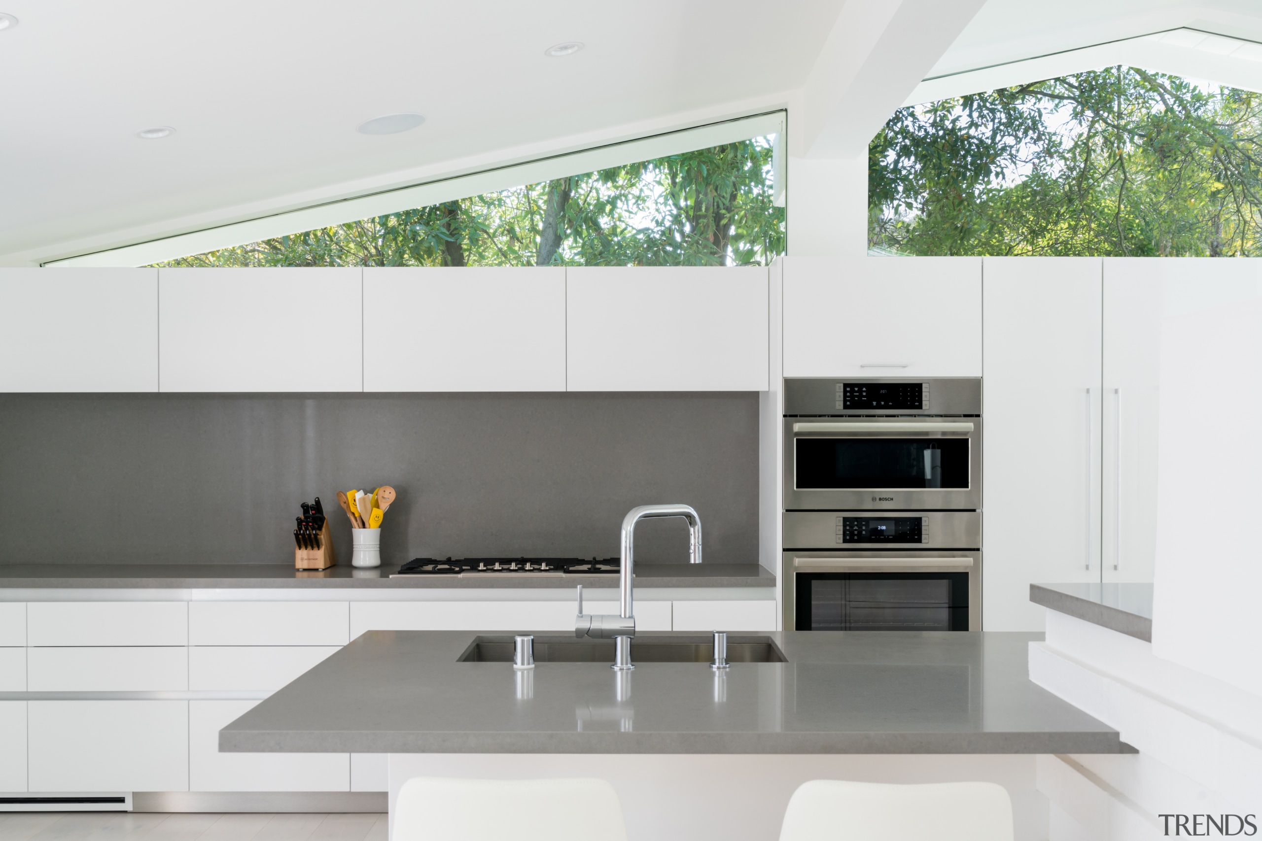 The kitchen is pared back to minimalist effect, 