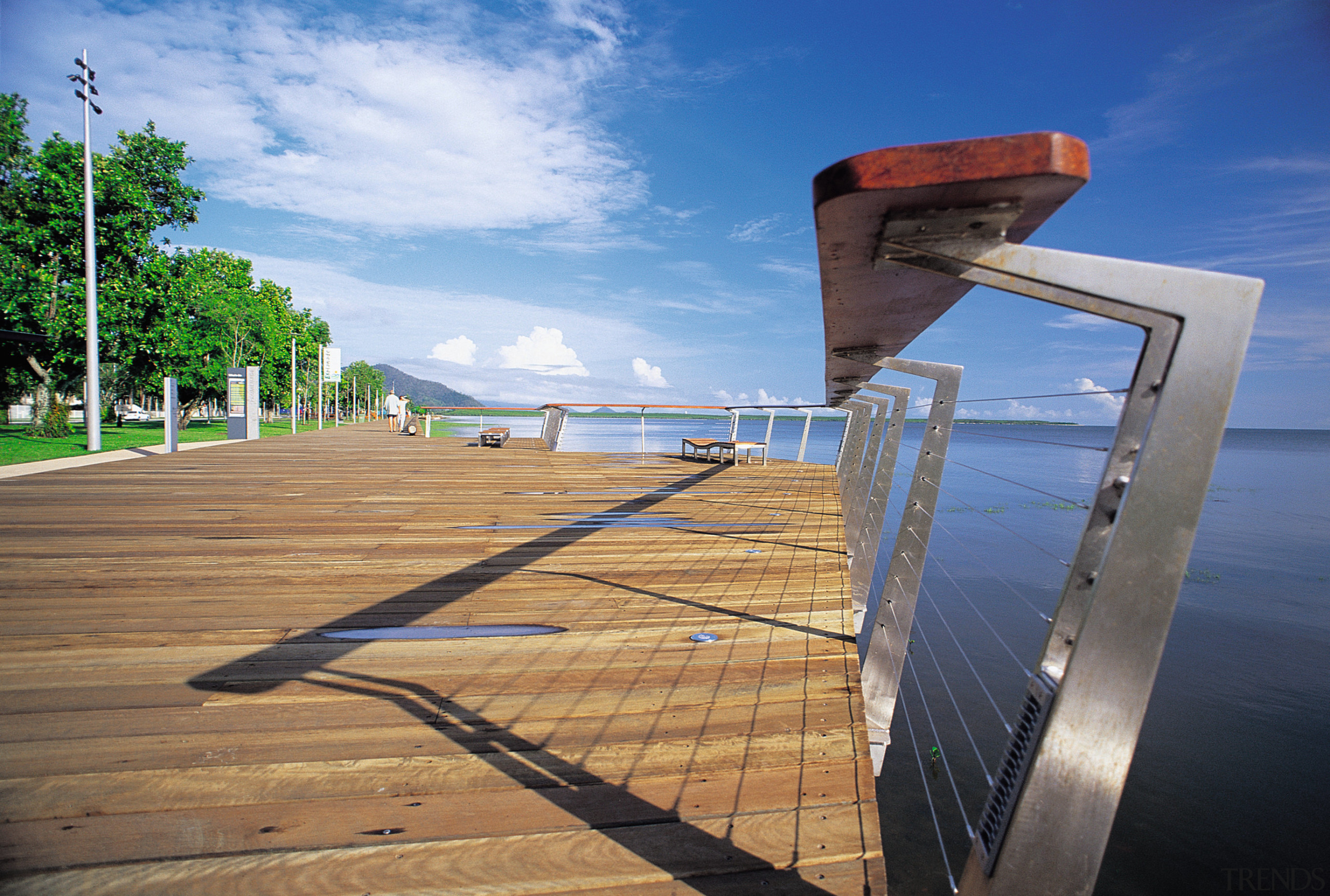 A close up view of the wooden and boardwalk, cloud, fixed link, horizon, sea, sky, walkway, water, teal