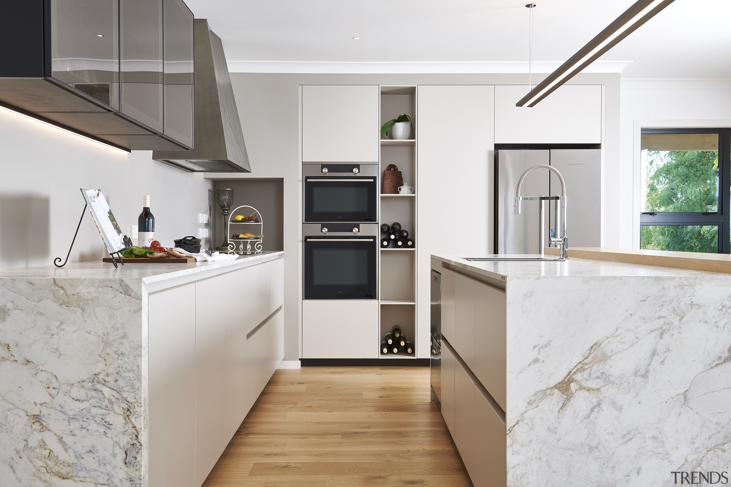 Relaxed kitchen celebrates traditional tones and minimalist cabinetry architecture, building, cabinetry, ceiling, countertop, cuisine classique, floor, flooring, furniture, hardwood, home, house, interior design, kitchen, material property, property, room, tile, wood flooring, gray, white