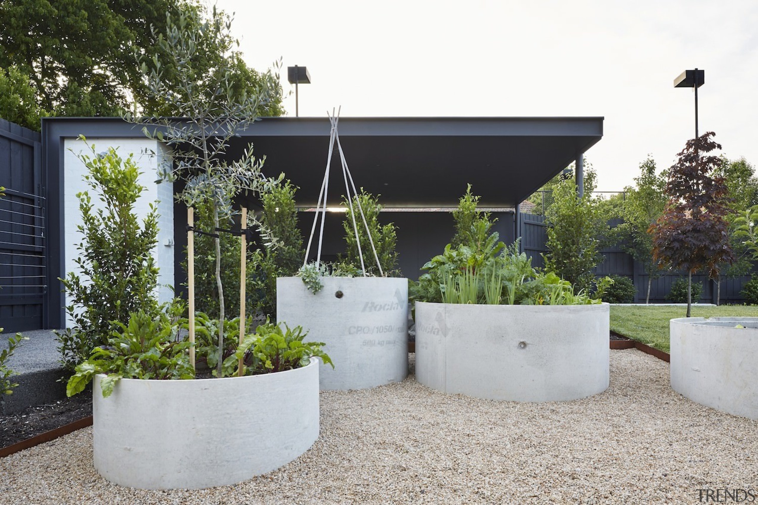 Concrete cylinders are useful planters - Concrete cylinders architecture, backyard, garden, home, house, outdoor structure, real estate, yard, white, gray