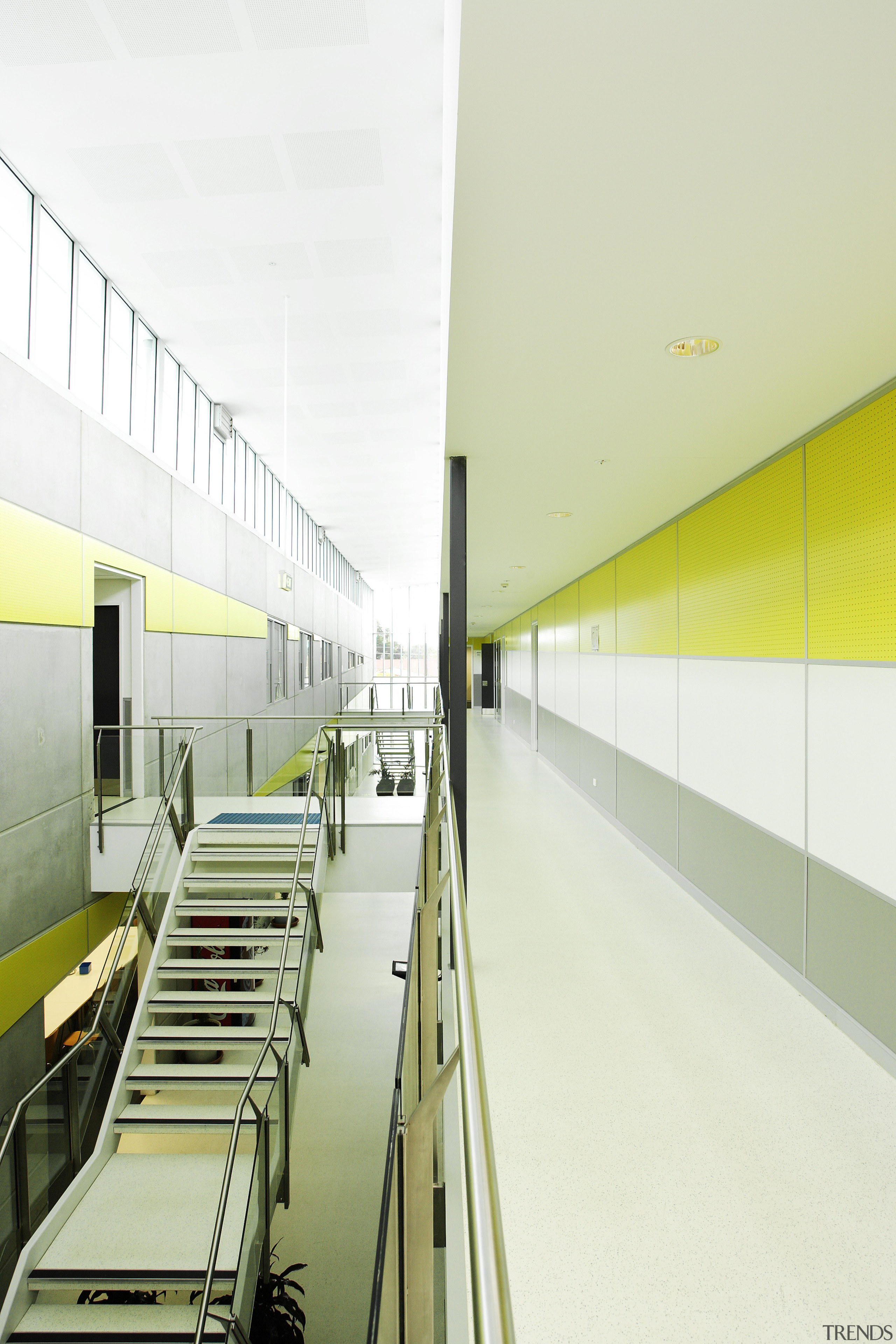 A central internal street bisects the building, providing architecture, ceiling, daylighting, interior design, office, product design, structure, yellow, white