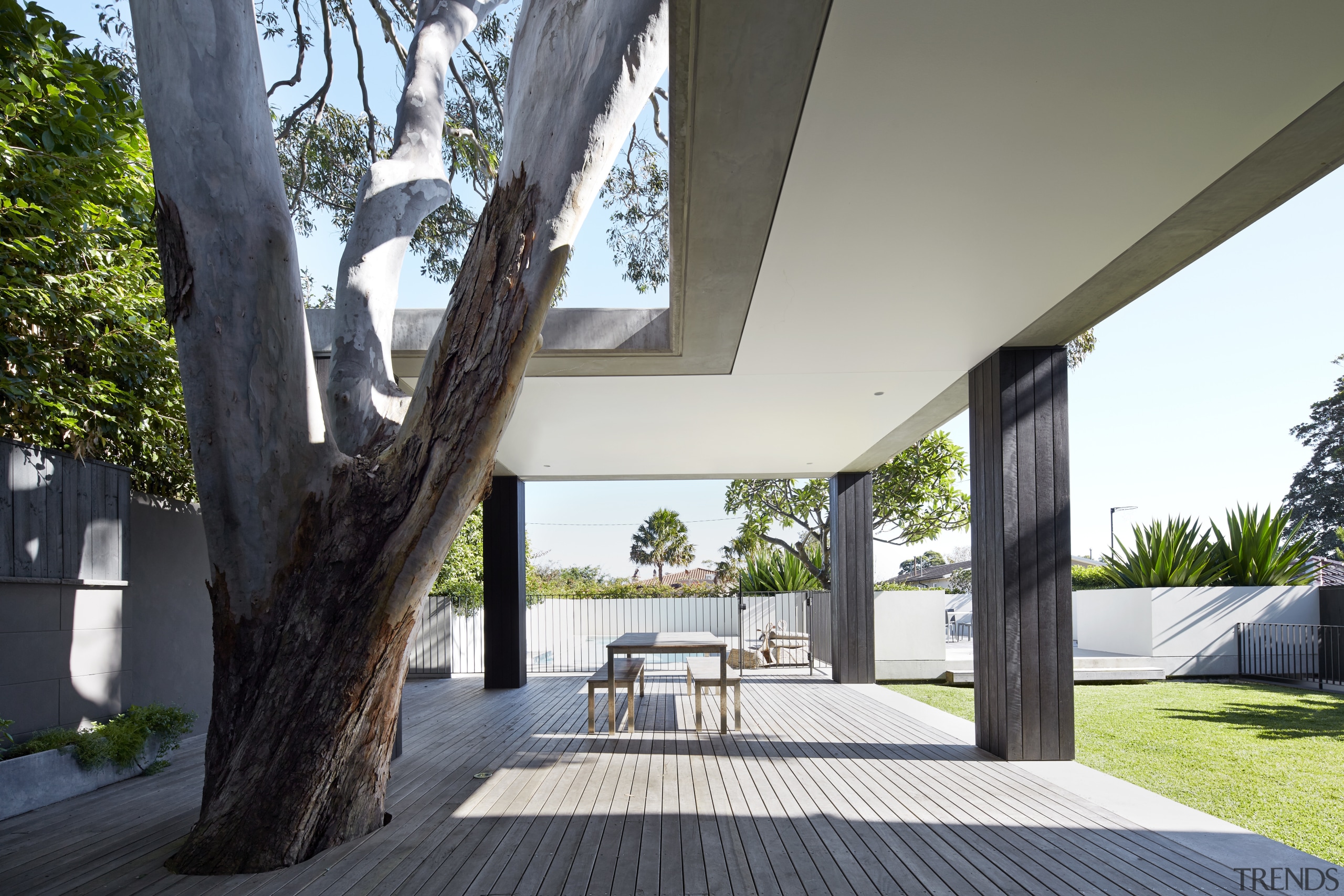 This expansive deck adds the functionality of a architecture, estate, home, house, interior design, outdoor structure, property, real estate, tree, white, black