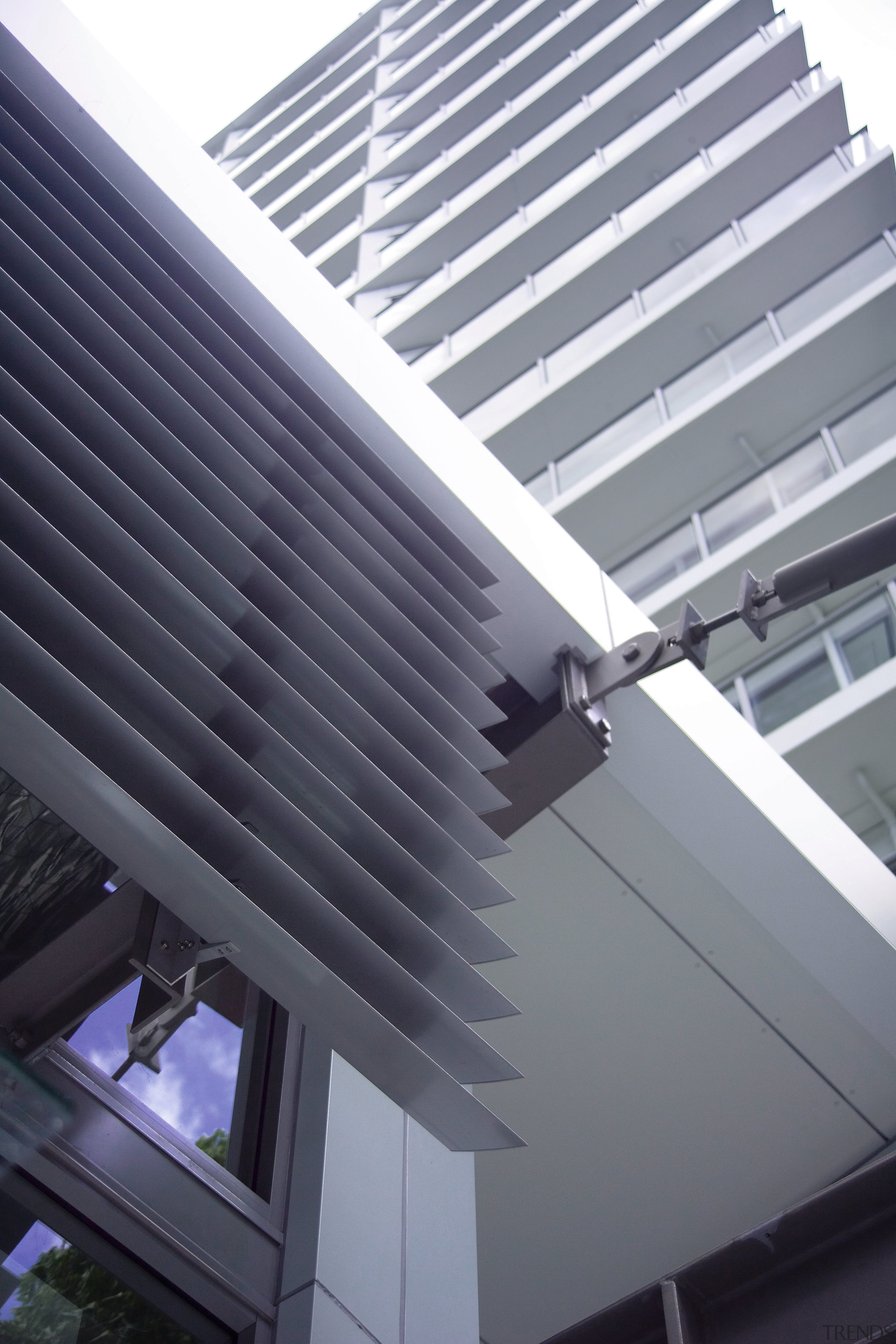 A close up view of some aluminium louvres angle, architecture, building, ceiling, daylighting, daytime, facade, glass, house, line, roof, siding, steel, structure, window, gray