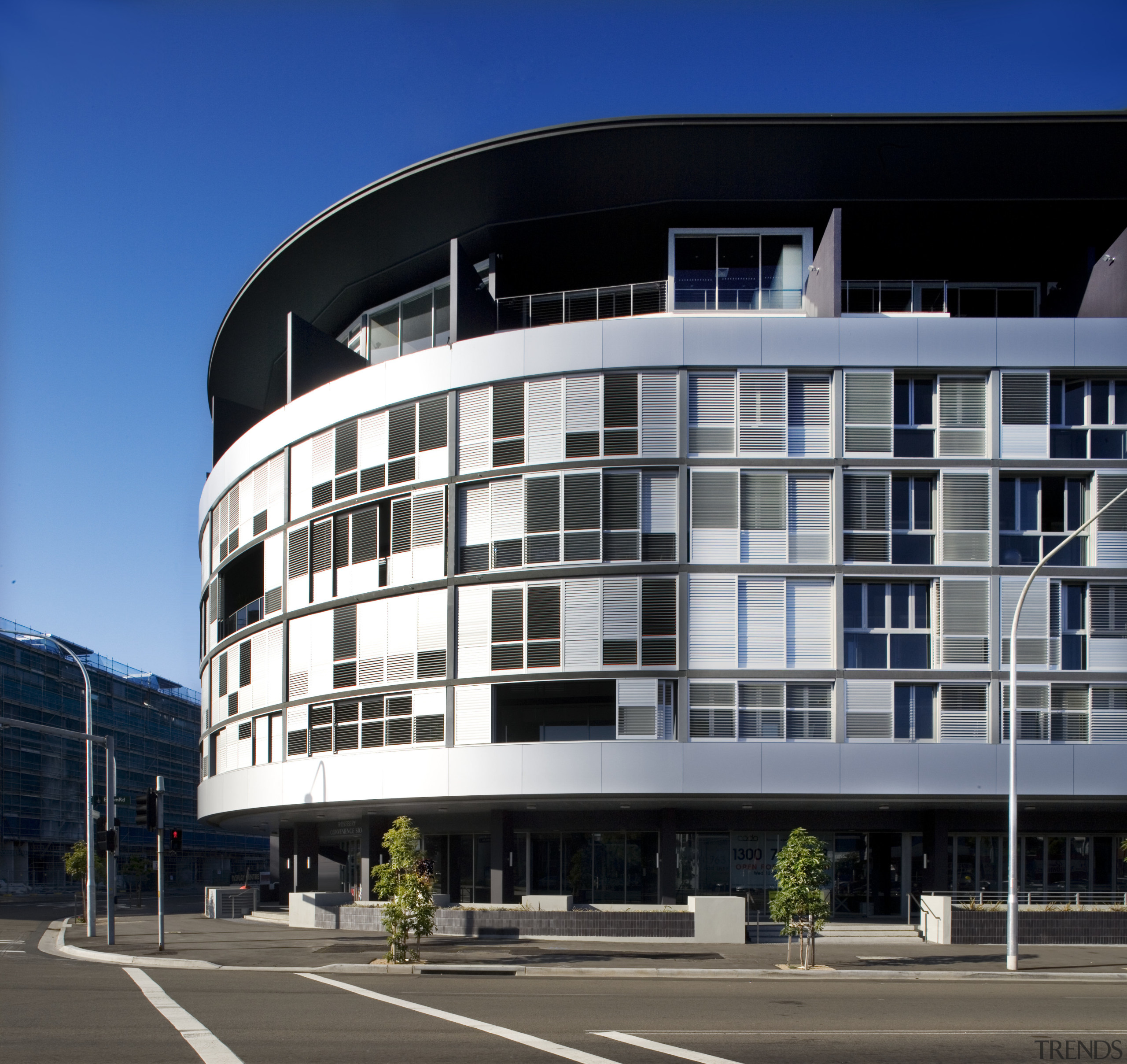 Exterior view of the apartment building looking from apartment, architecture, building, city, commercial building, condominium, corporate headquarters, daytime, facade, headquarters, metropolis, metropolitan area, mixed use, real estate, residential area, sky, window, black