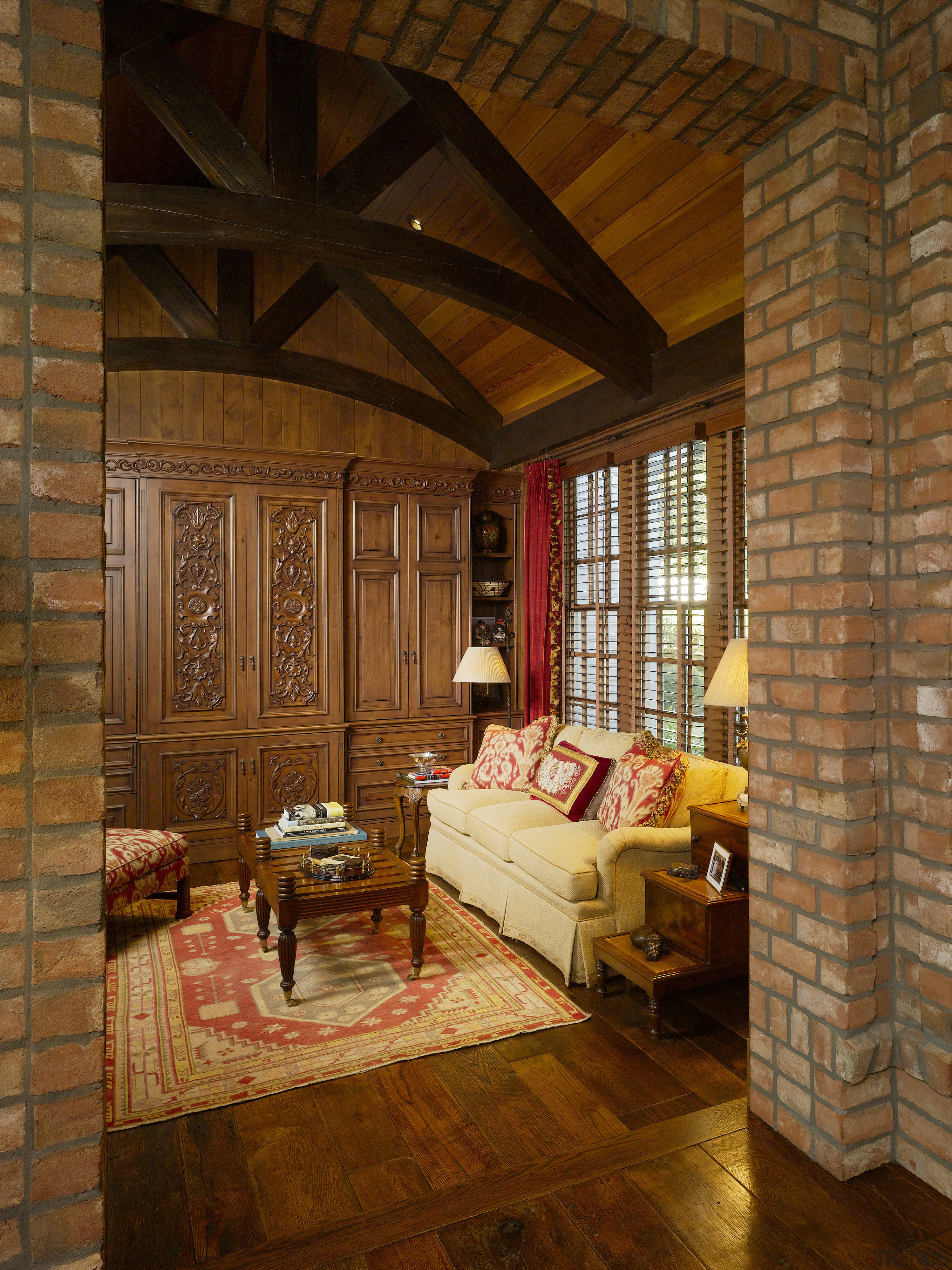 brick walls, exposed varnished rafters, lounge area, dark beam, ceiling, floor, flooring, hardwood, home, interior design, living room, log cabin, room, wall, window, wood, wood flooring, brown