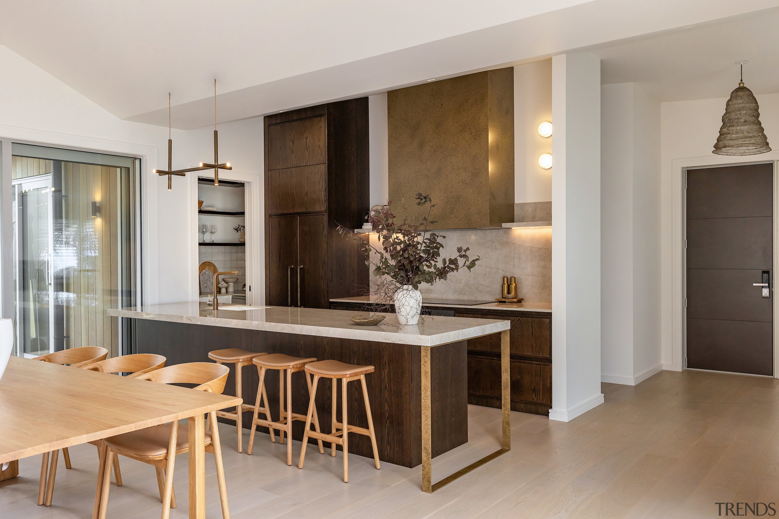 Breakfast stools and dinner seating enjoy tonal connection. 