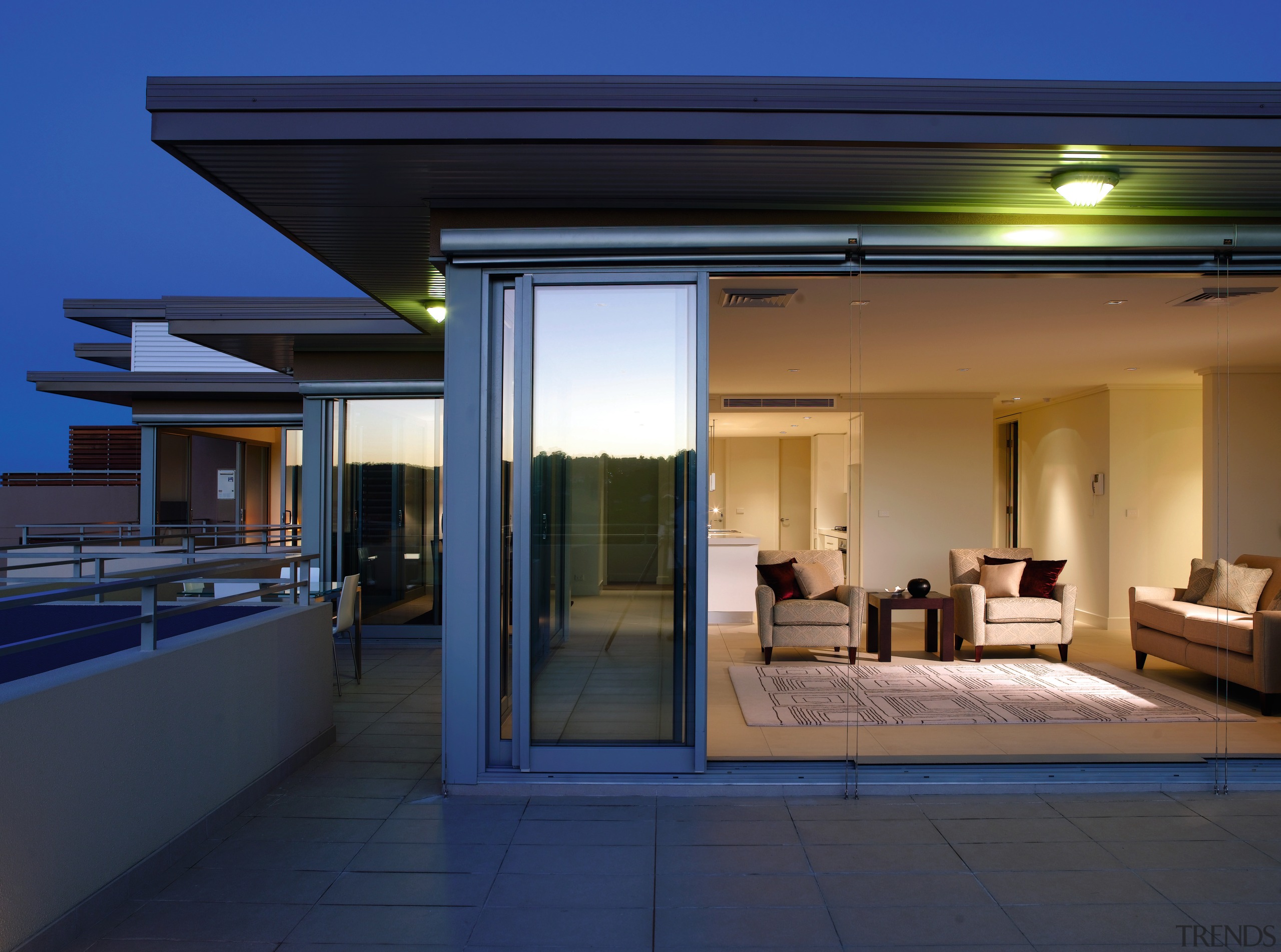 An exterior view of the Edgecliff Apartment Developments architecture, estate, home, house, interior design, lighting, property, real estate, roof, window, blue