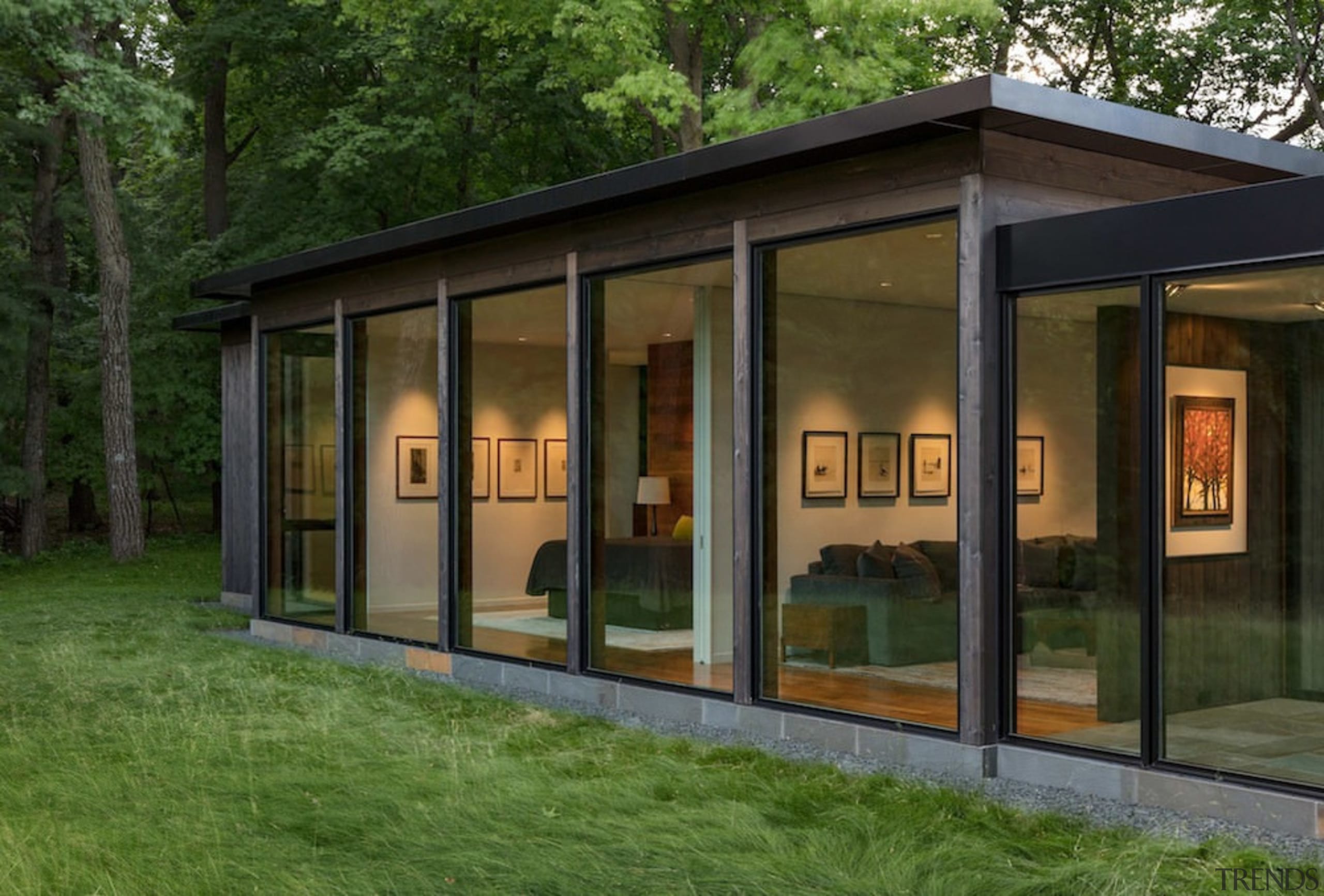 The large windows allow for excellent views of house, brown, green