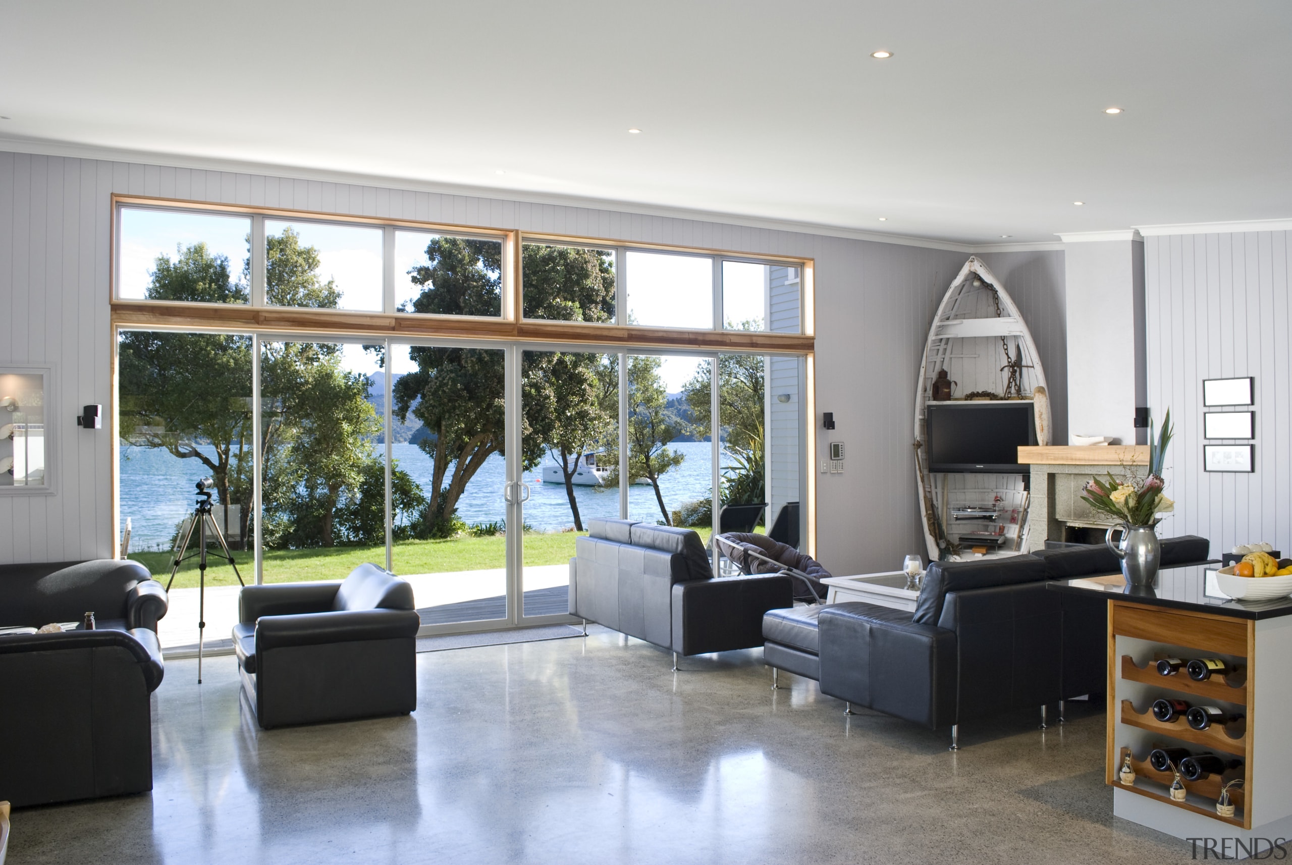 View of the open-plan living area with leather floor, home, house, interior design, living room, real estate, room, window, gray